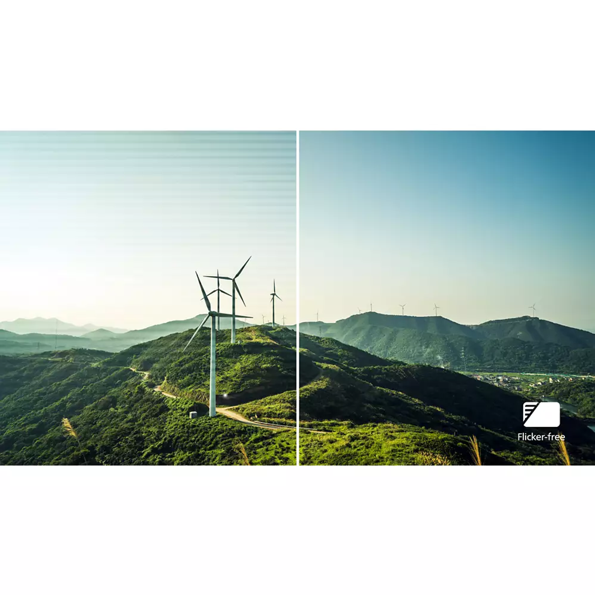 Vista di mulini a vento su una collina verde, cielo sereno.