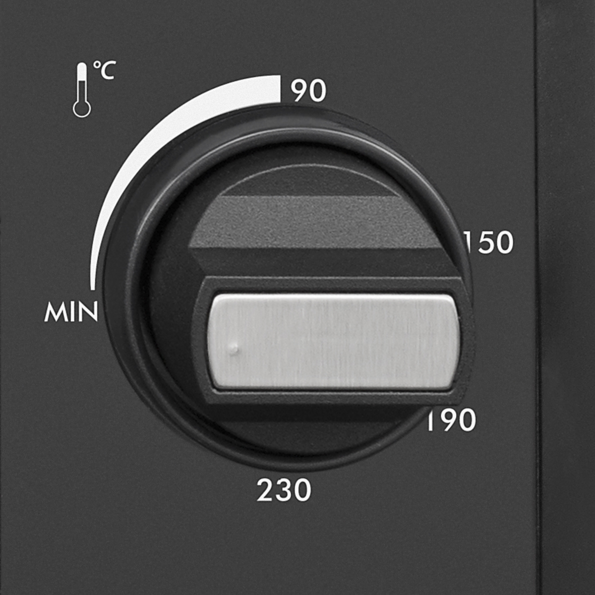 Primer plano de un dial negro con ajustes de temperatura. El dial tiene números y un puntero para ajustar el calor.