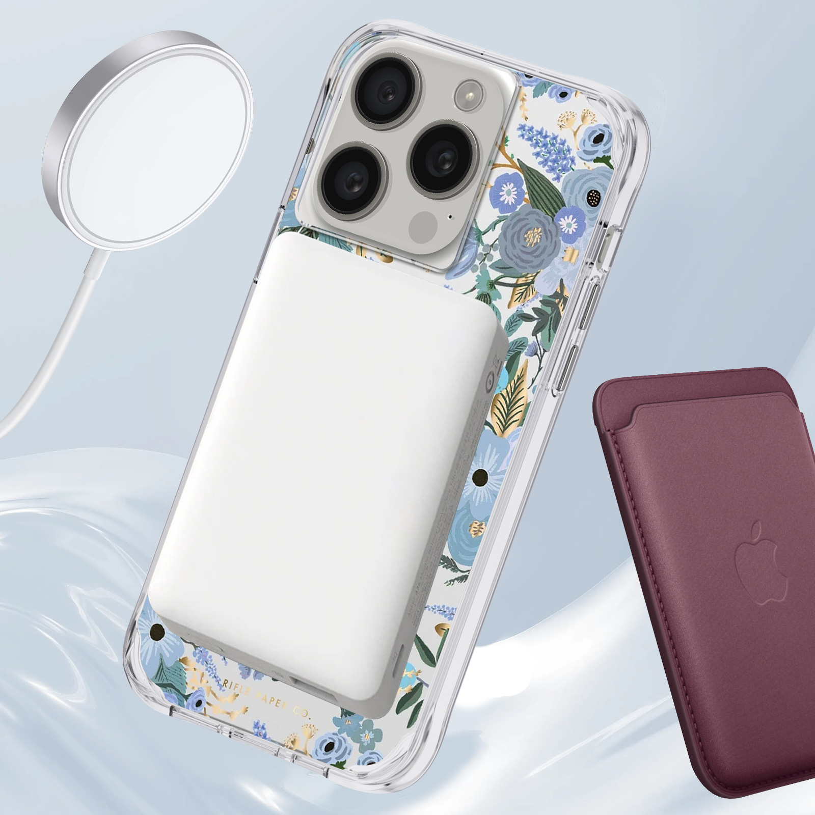 Telefon mit floraler Hülle, kabellosem Ladegerät und weinrotem Kartenhalter auf Gradienten.