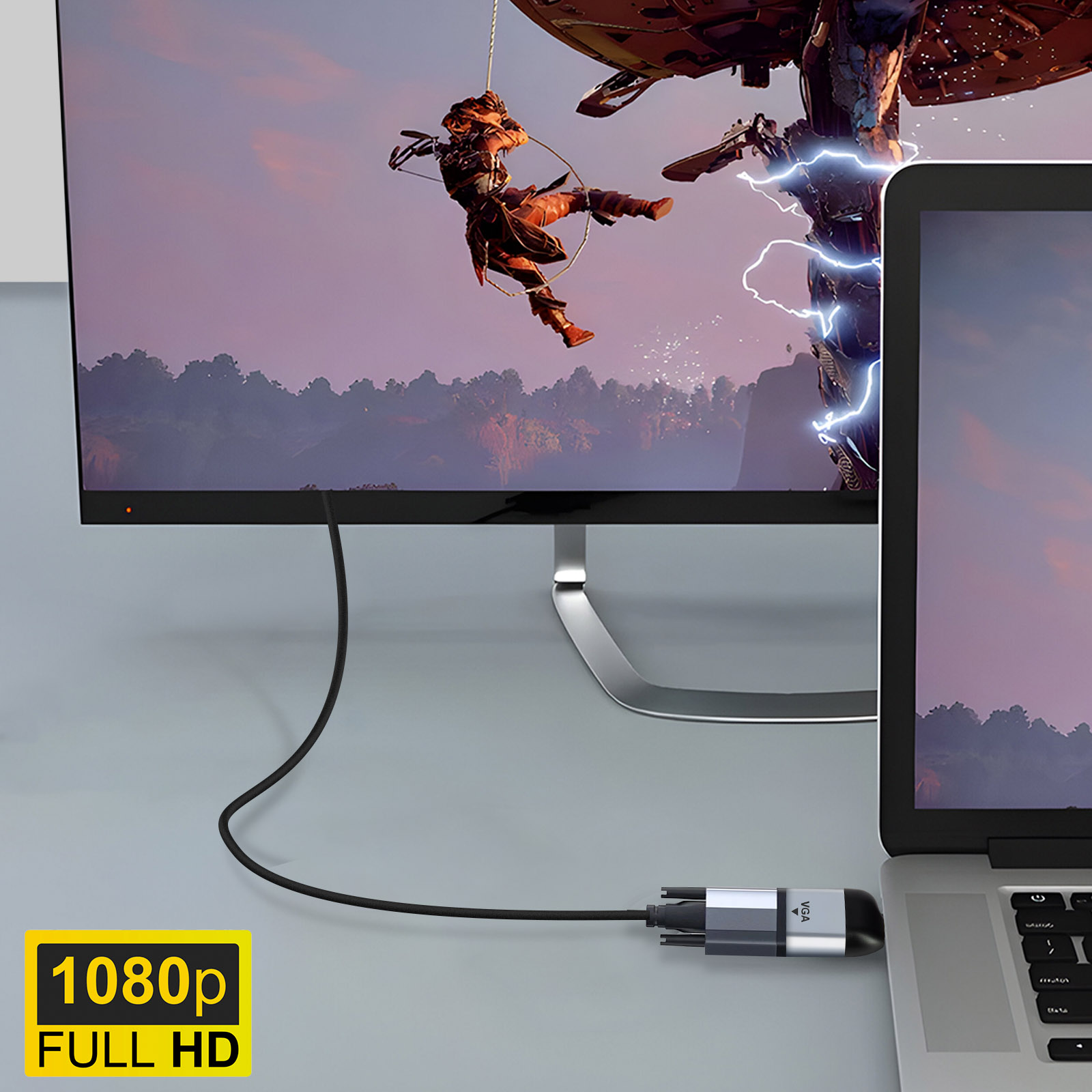 Un laptop e un monitor sono collegati con un cavo VGA. Il monitor visualizza una scena di gioco.