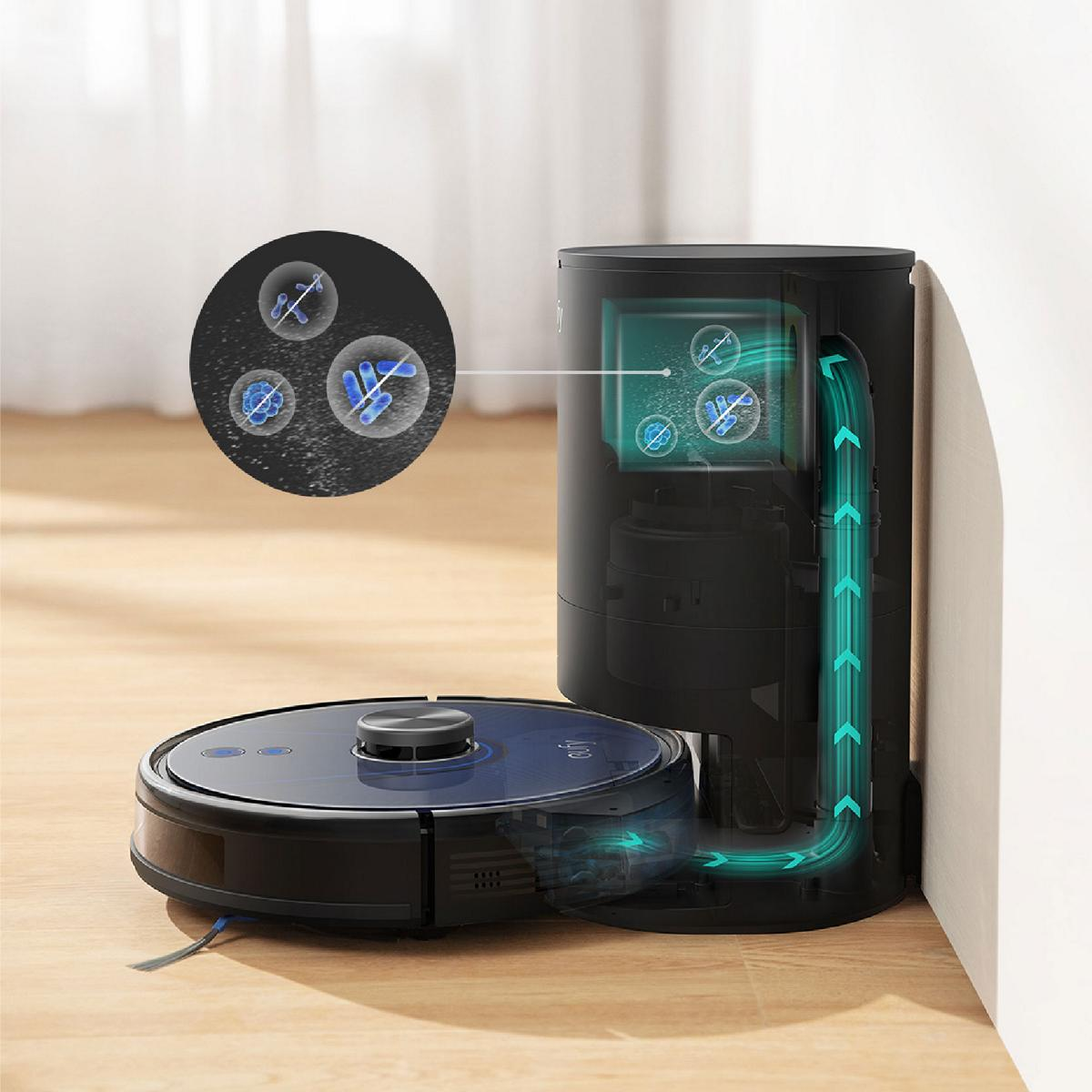 Robot odkurzający obok stacji ładującej. Obrazek przedstawia proces czyszczenia ze strzałkami i cząsteczkami.