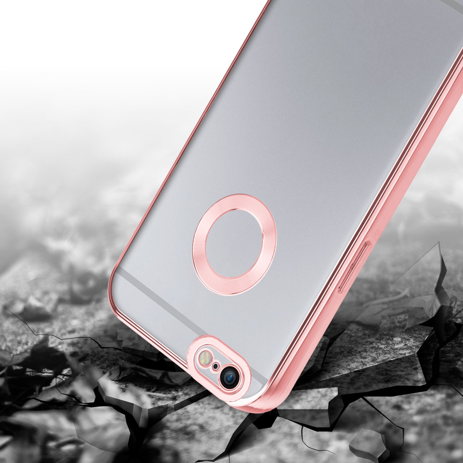 Eine Handyhülle liegt auf zerbrochenem Boden. Sie hat einen rosa Rand mit Kamera und Ring.