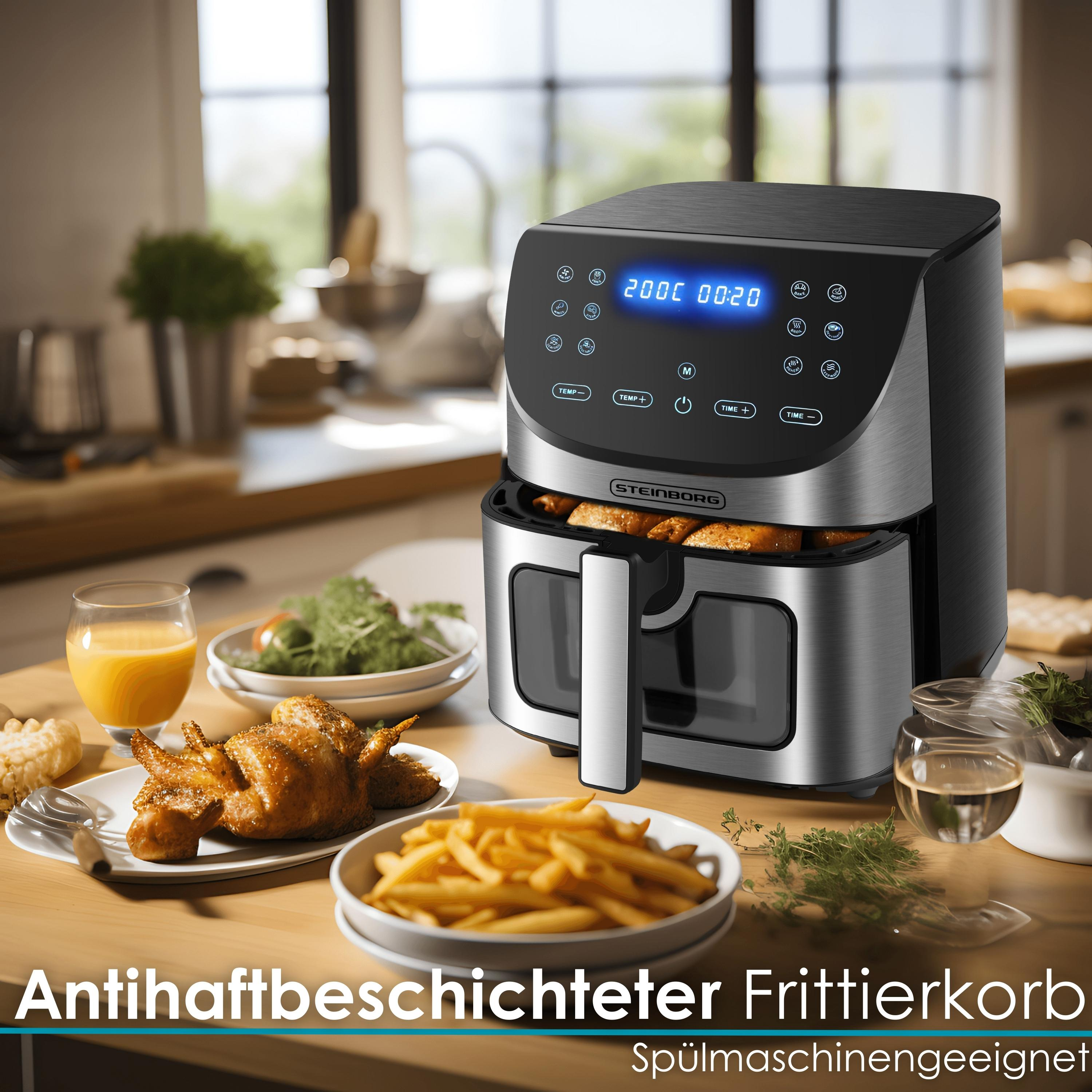 Friteuse à air avec plats cuisinés, jus et plats sur une table en bois.