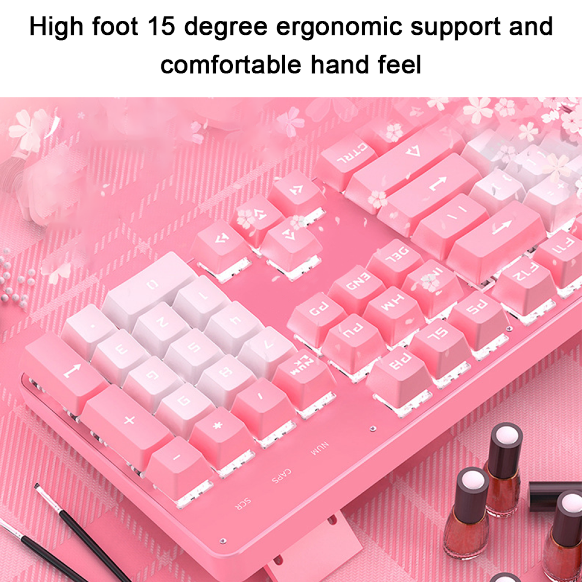 Rosa Tastatur mit weißen Tasten. Nagellackflaschen, Pinsel. Kirschblüten-Thema.