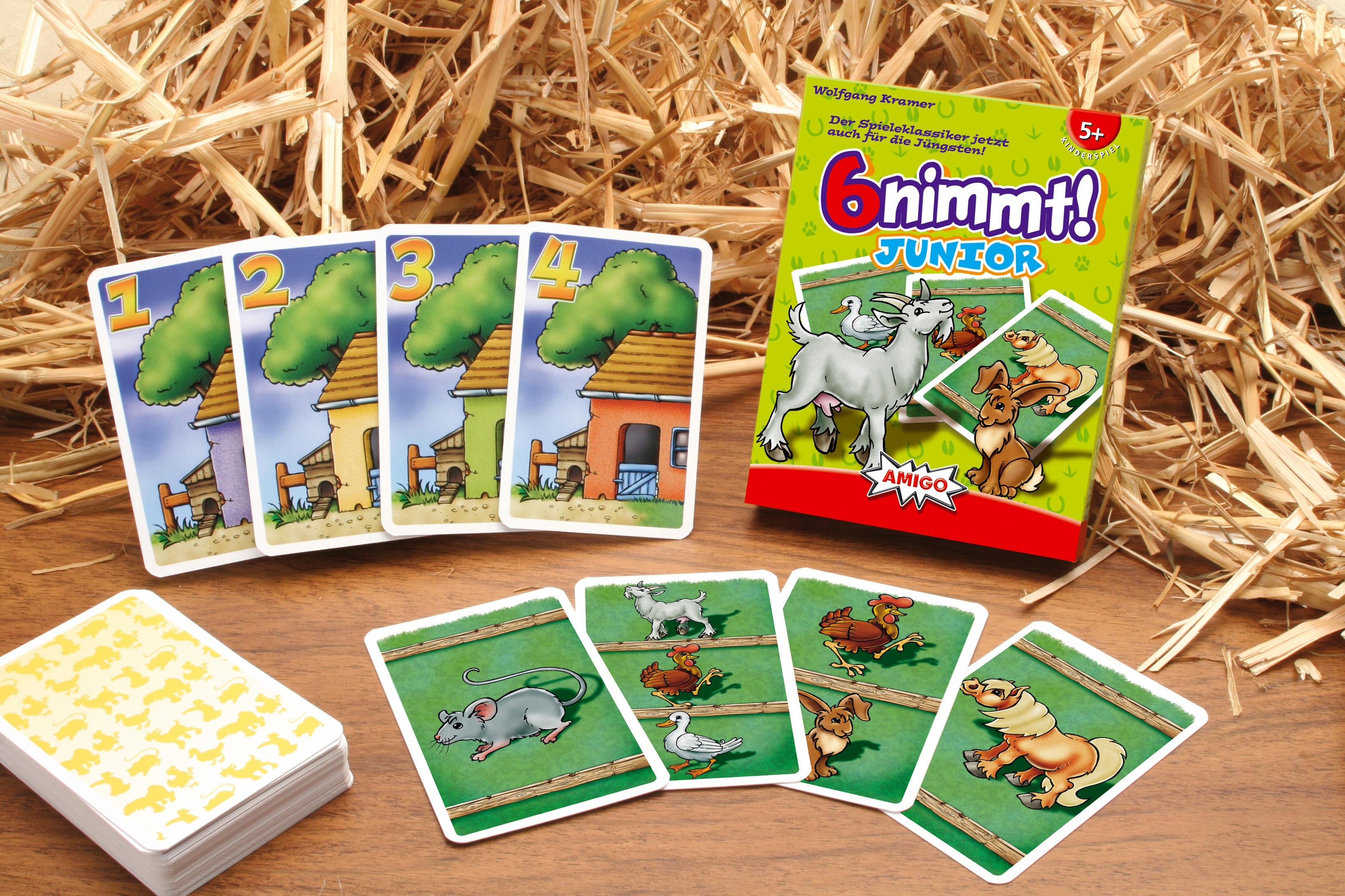 Ein Spielkartenspiel mit dem Namen '6 nimmt! Junior', mit bunten Tierillustrationen, auf einer Holzoberfläche.