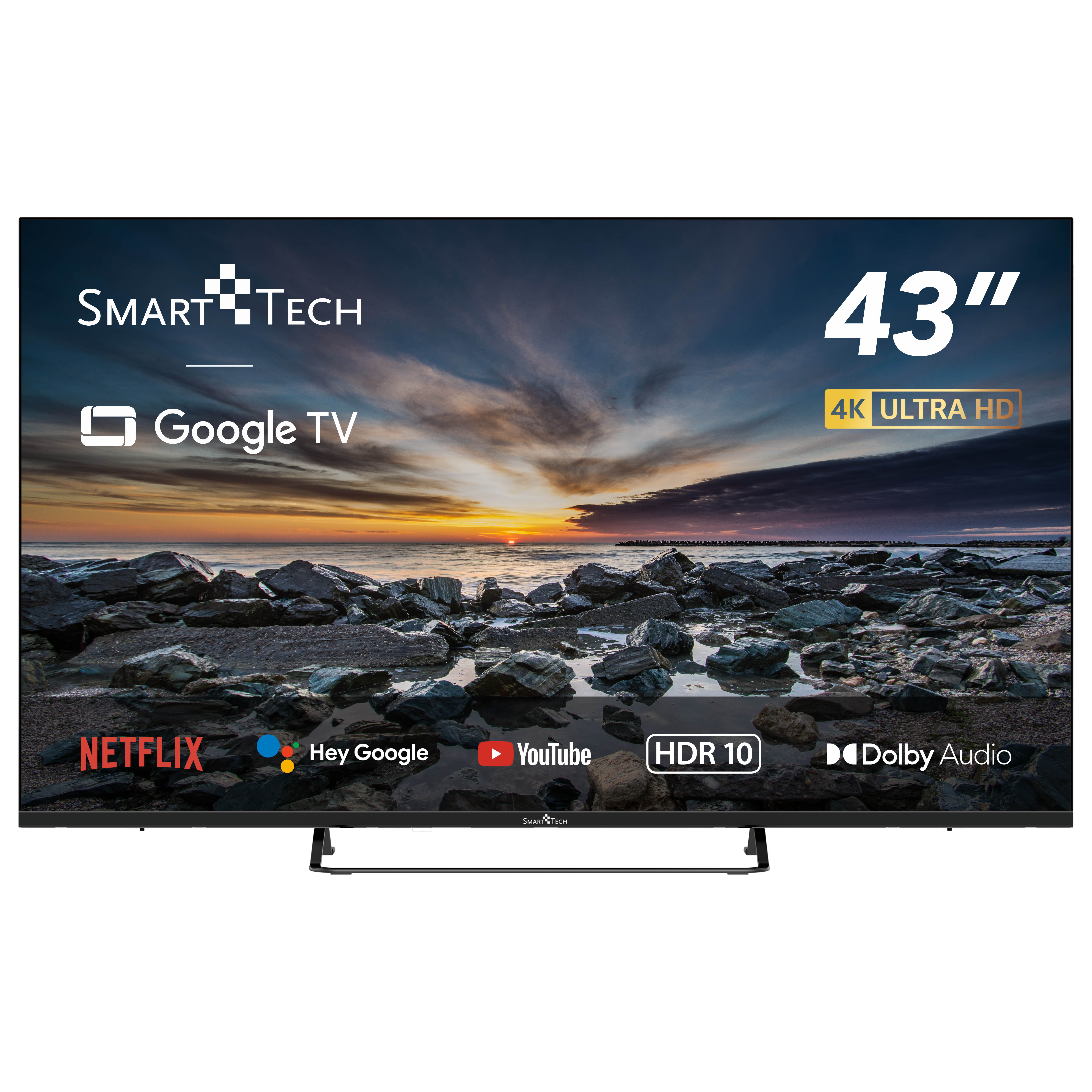 Un televisor Smart Tech de 43" muestra una escena de atardecer, con logotipos y un soporte negro.