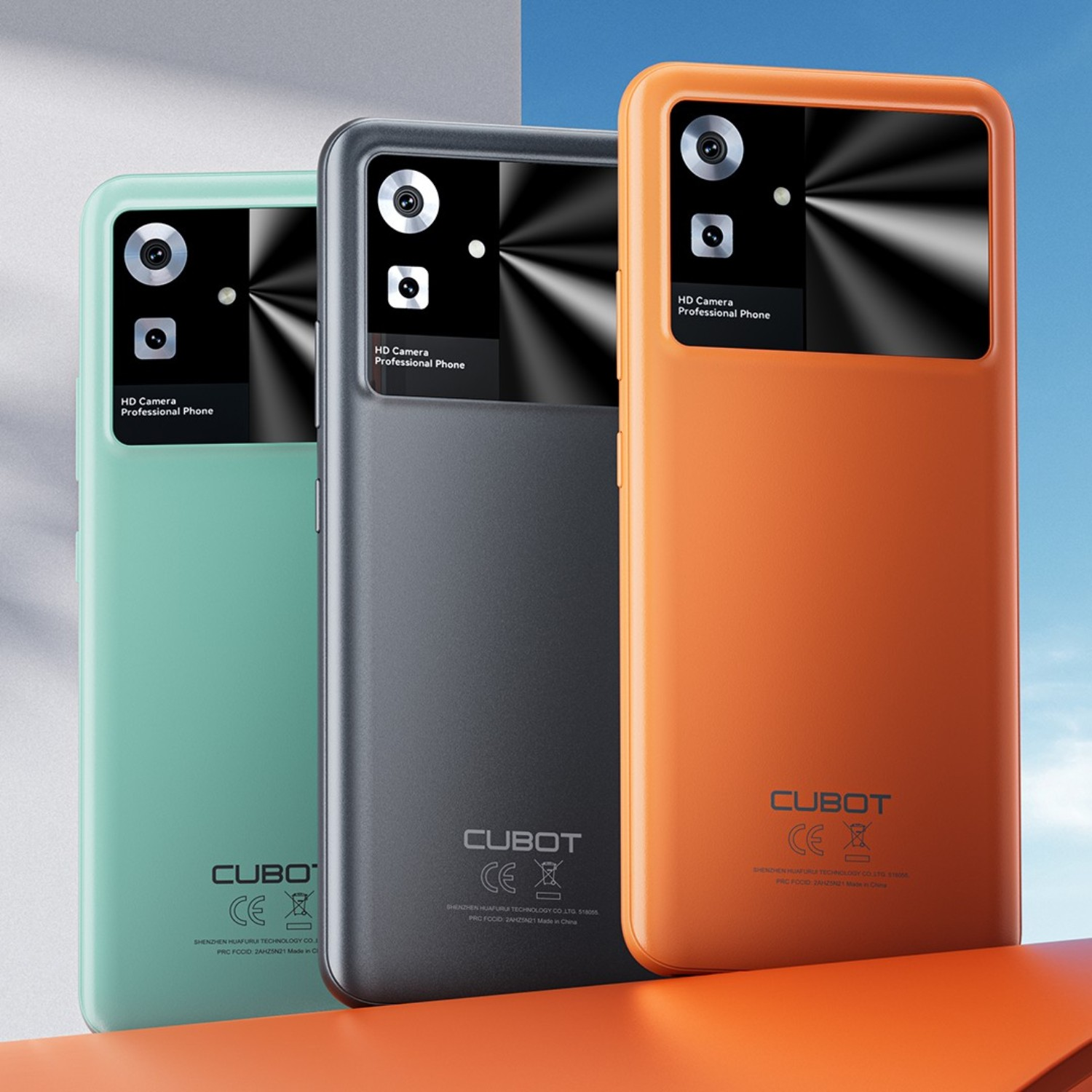 Tre smartphone: menta, grigio e arancione, con fotocamere nere.