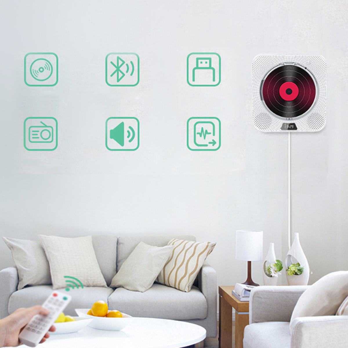 Ein tragbarer CD-Player an der Wand, mit Fernbedienung und Symbolen.