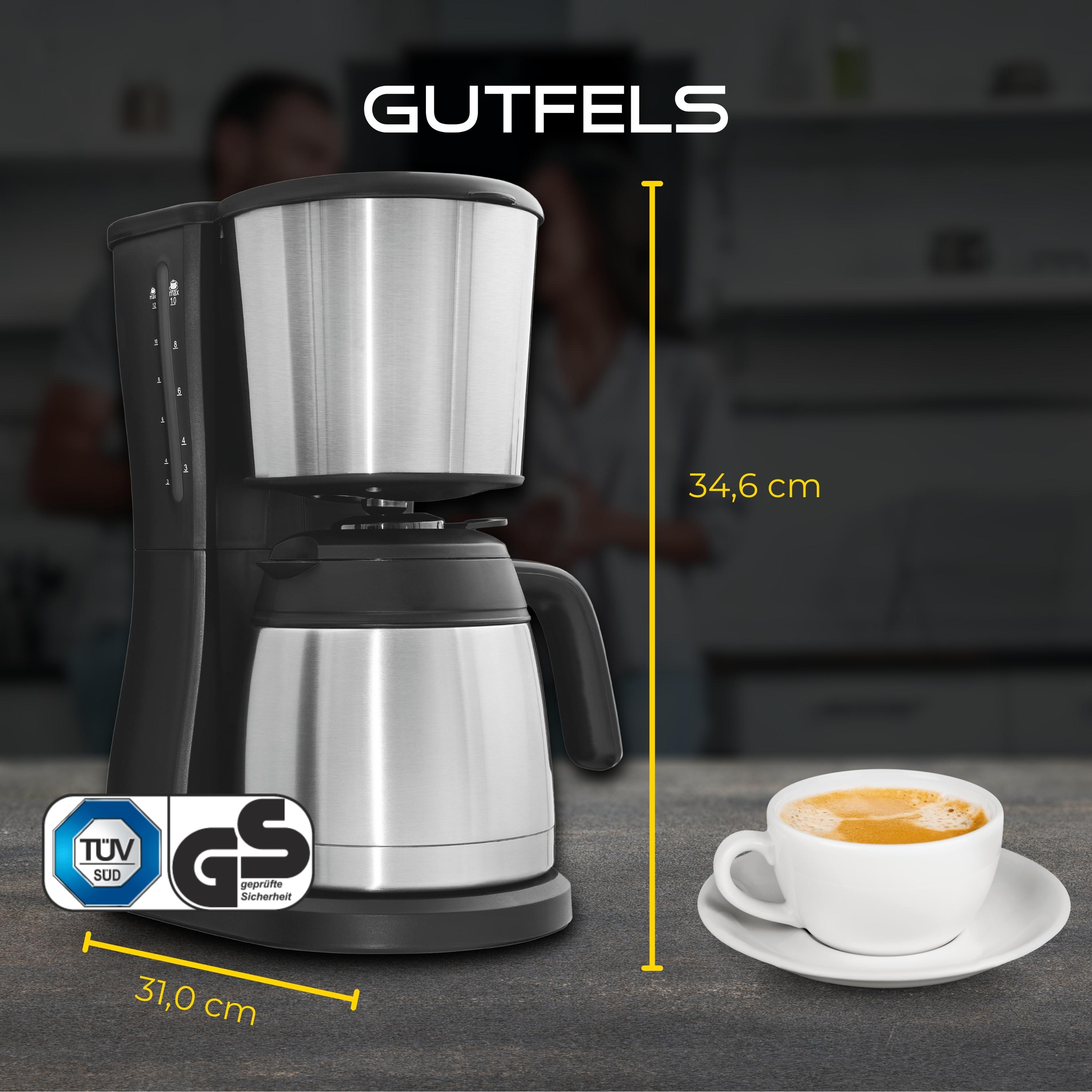 Eine schwarze und silberne Kaffeemaschine mit einer Tasse Kaffee und einem Maß von 34,6 cm.