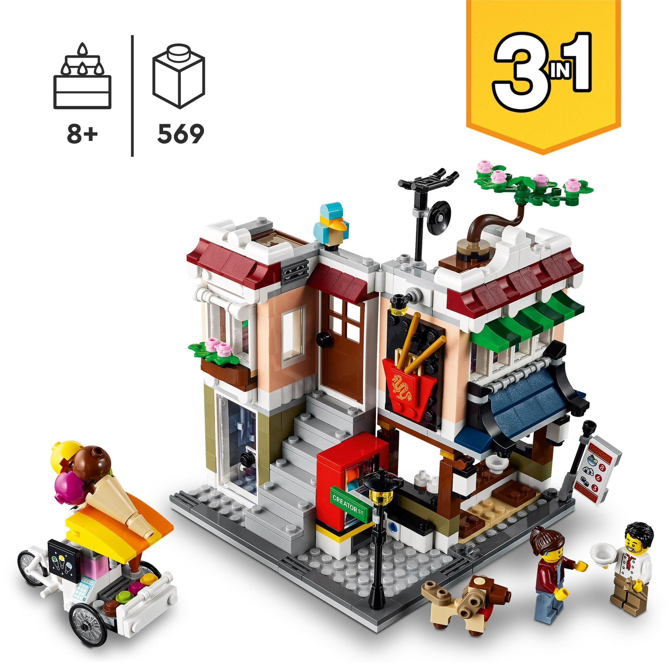Ein Lego-Set eines Gebäudes mit Eiswagen und Minifiguren, gekennzeichnet als 3-in-1 für Kinder ab 8 Jahren.