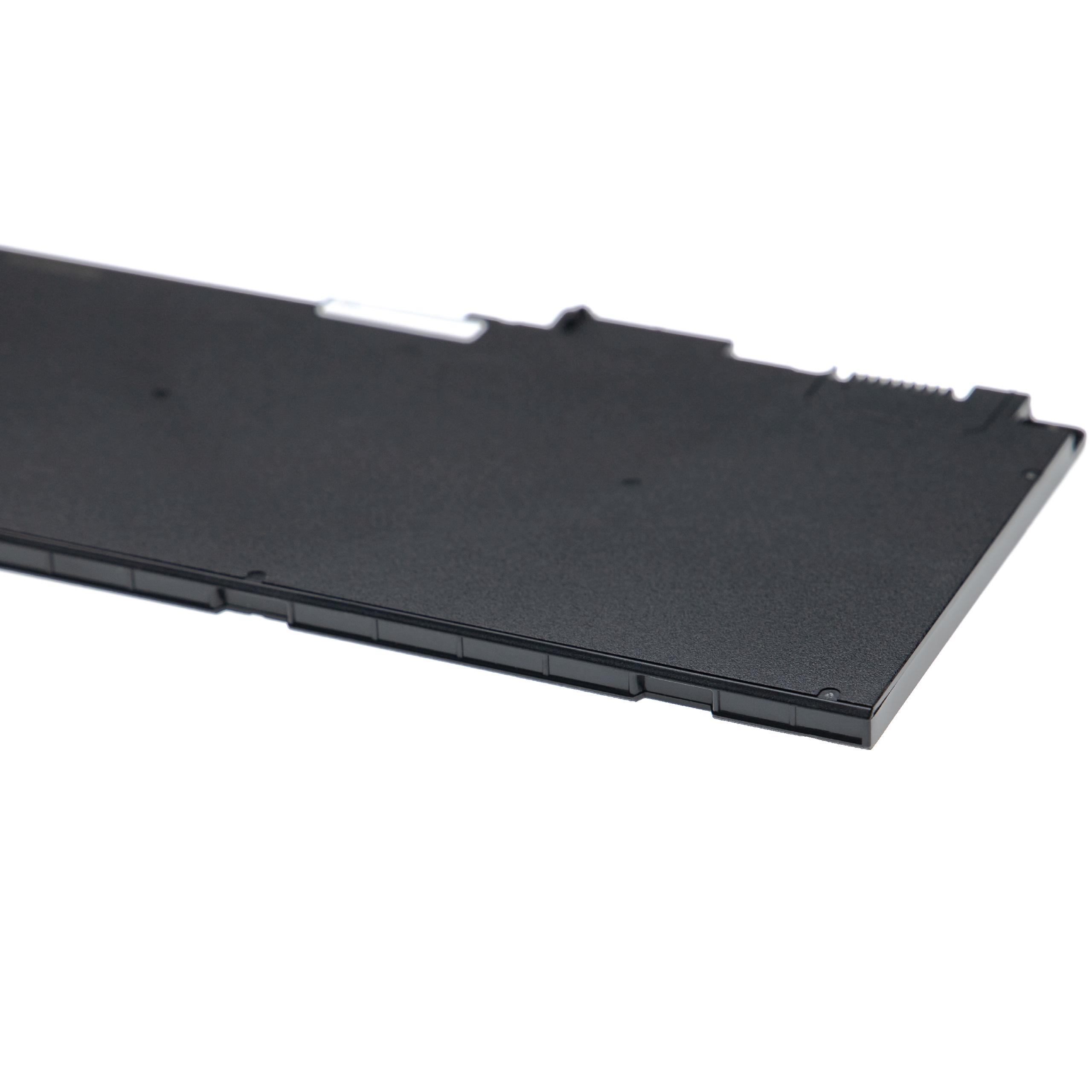 Schwarzes Gerät mit strukturierter Oberfläche auf weißem Hintergrund, möglicherweise ein Laptop-Teil.