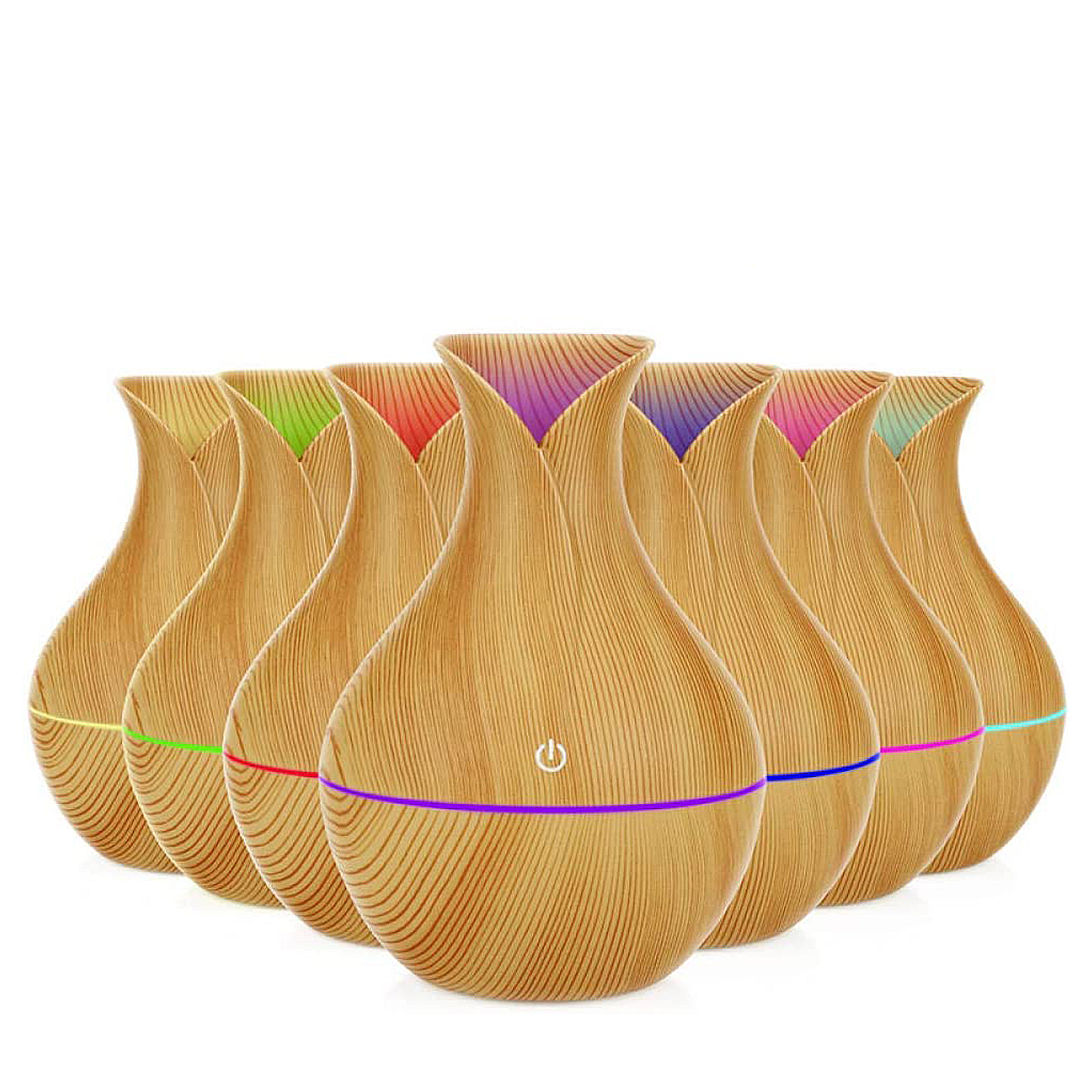 Un grupo de difusores de aspecto de madera con luces de colores en la base, dispuestos en fila.