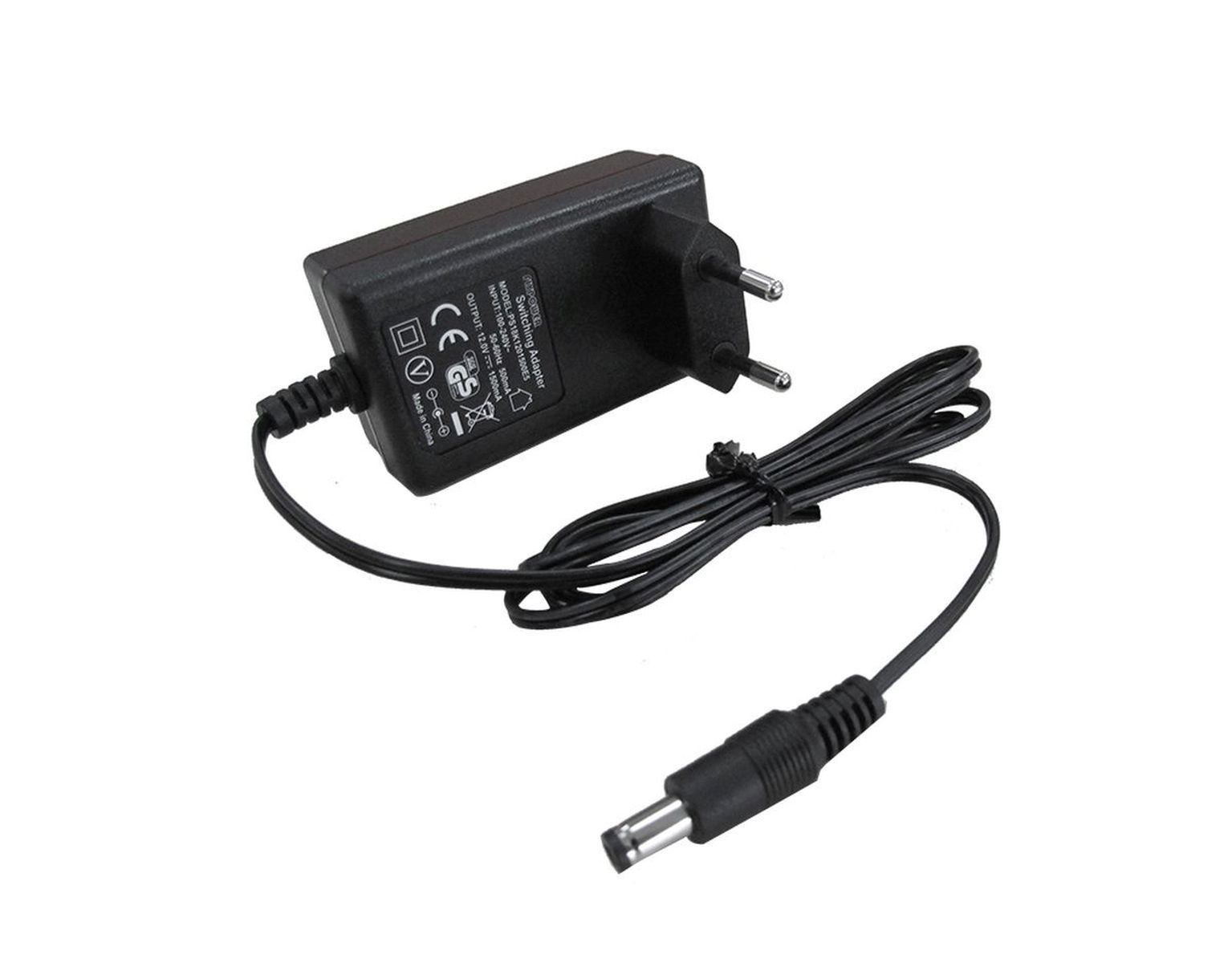 Schwarzes Netzteil mit Kabel und Stecker auf weißer Oberfläche.