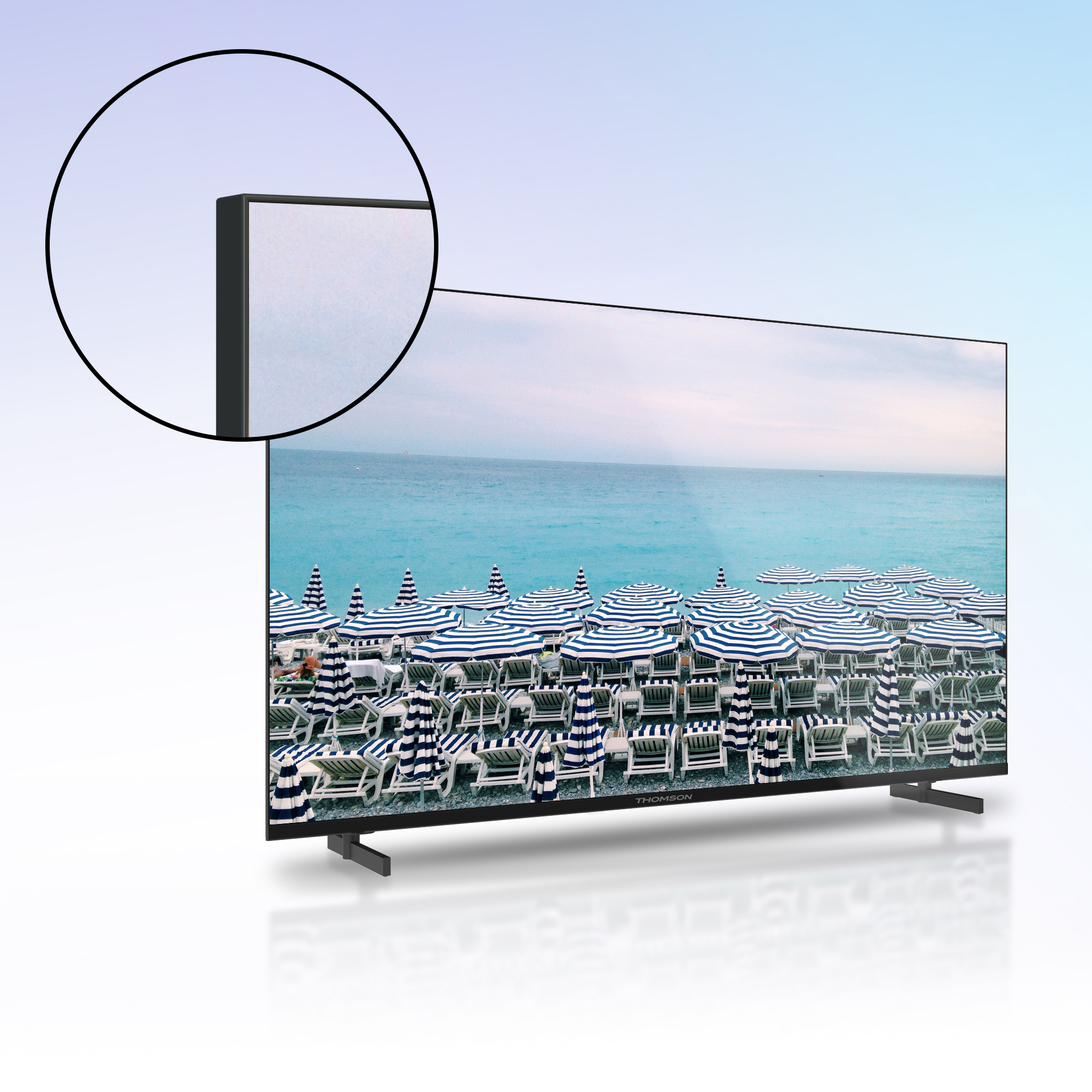 Un grande televisore nero che mostra una scena di spiaggia con ombrelloni blu.