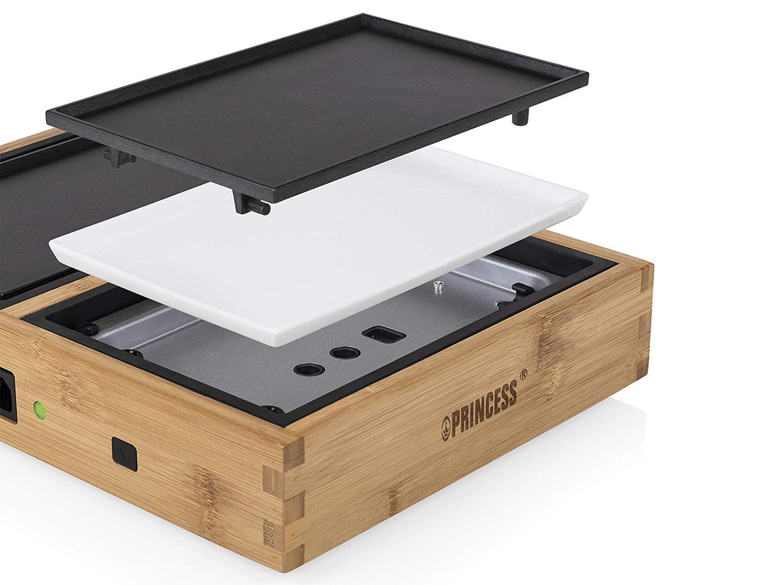 Elektrischer Holzgrill mit schwarzer Oberseite, weißer Platte und Metallsockel, auf weißer Oberfläche.