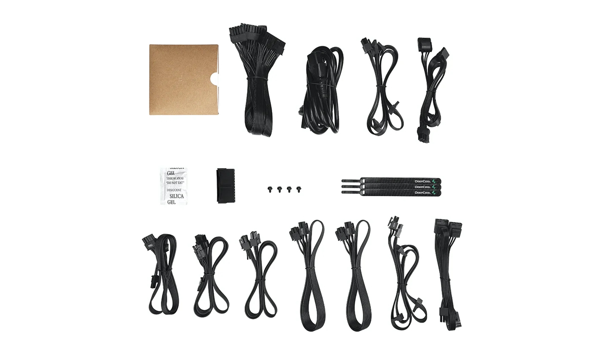 Assorted computer power supply components, including cables and connectors, arranged on a white surface.
