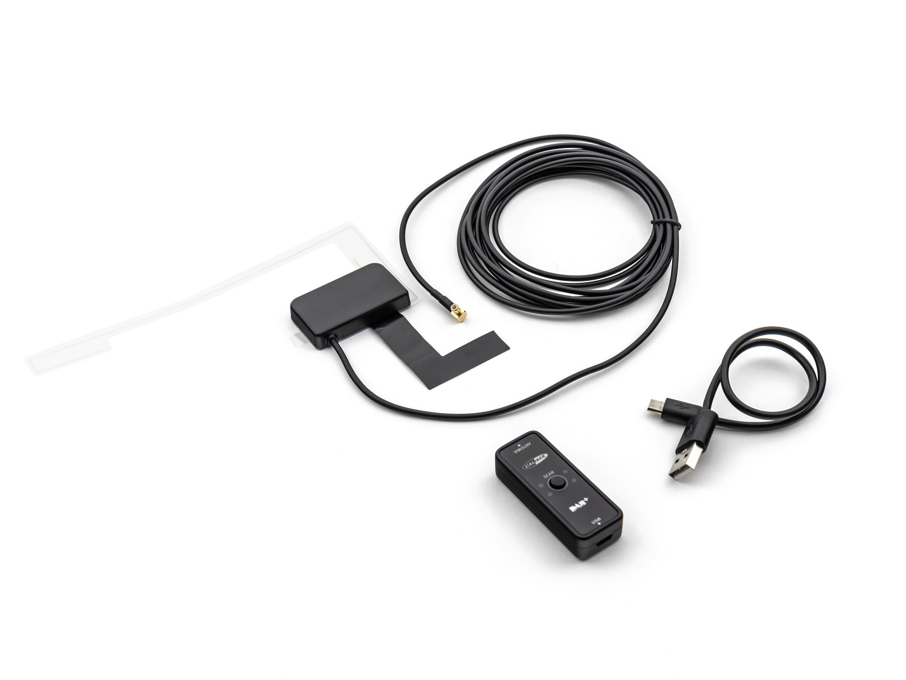 Verschiedene elektronische Komponenten: Ein schwarzes Gerät mit Kabel, ein weißes Rechteck.