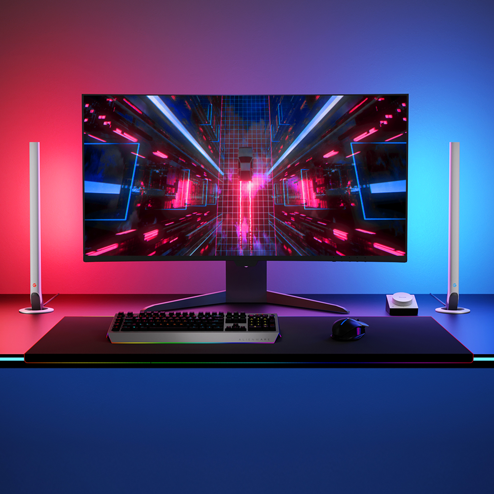 Ein Gaming-Setup mit einem großen Monitor und einer Tastatur. Der Hintergrund hat rote und blaue Lichter.