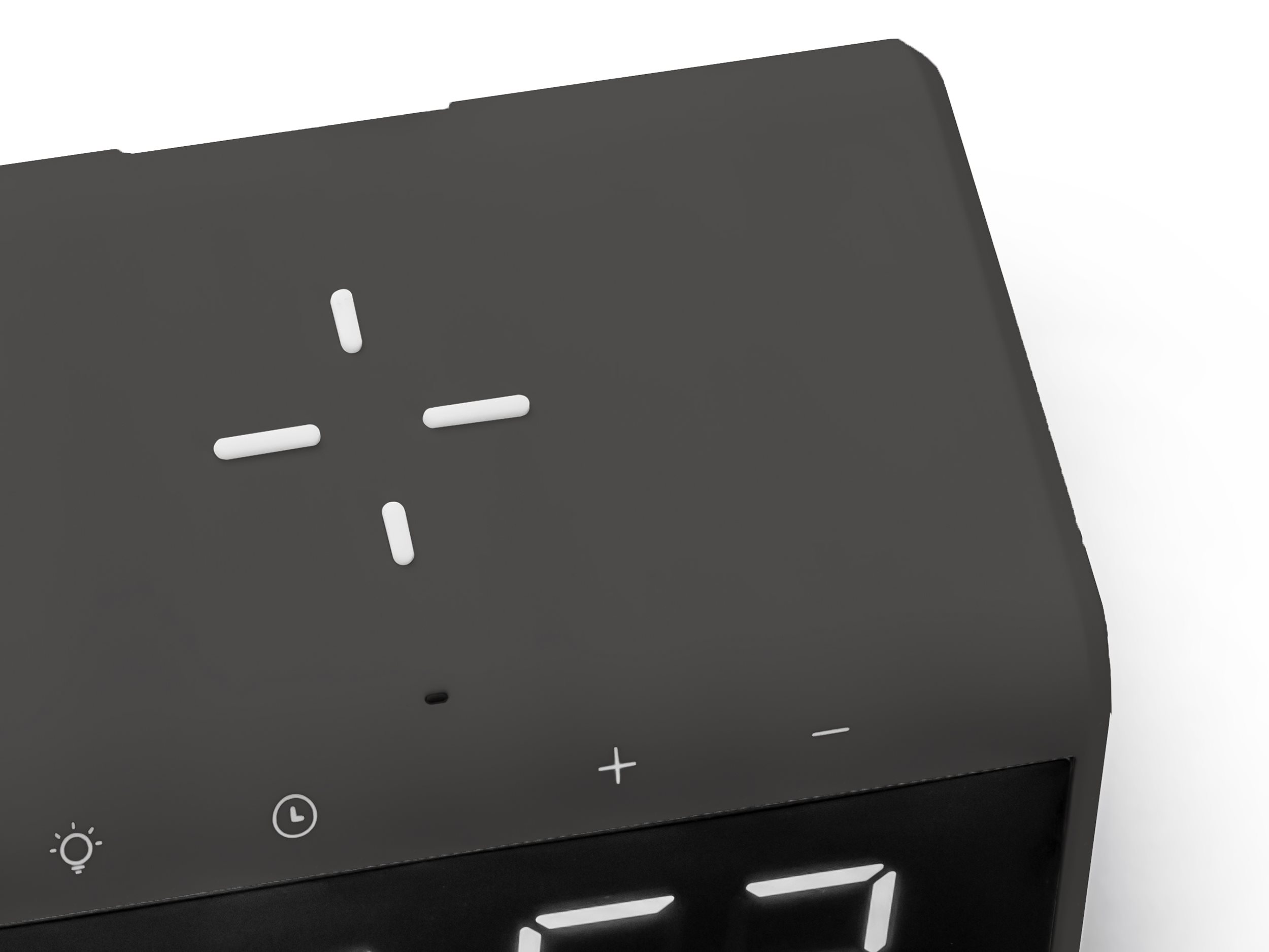 Close-up of a black alarm clock with touch controls and a digital display, against a white background.