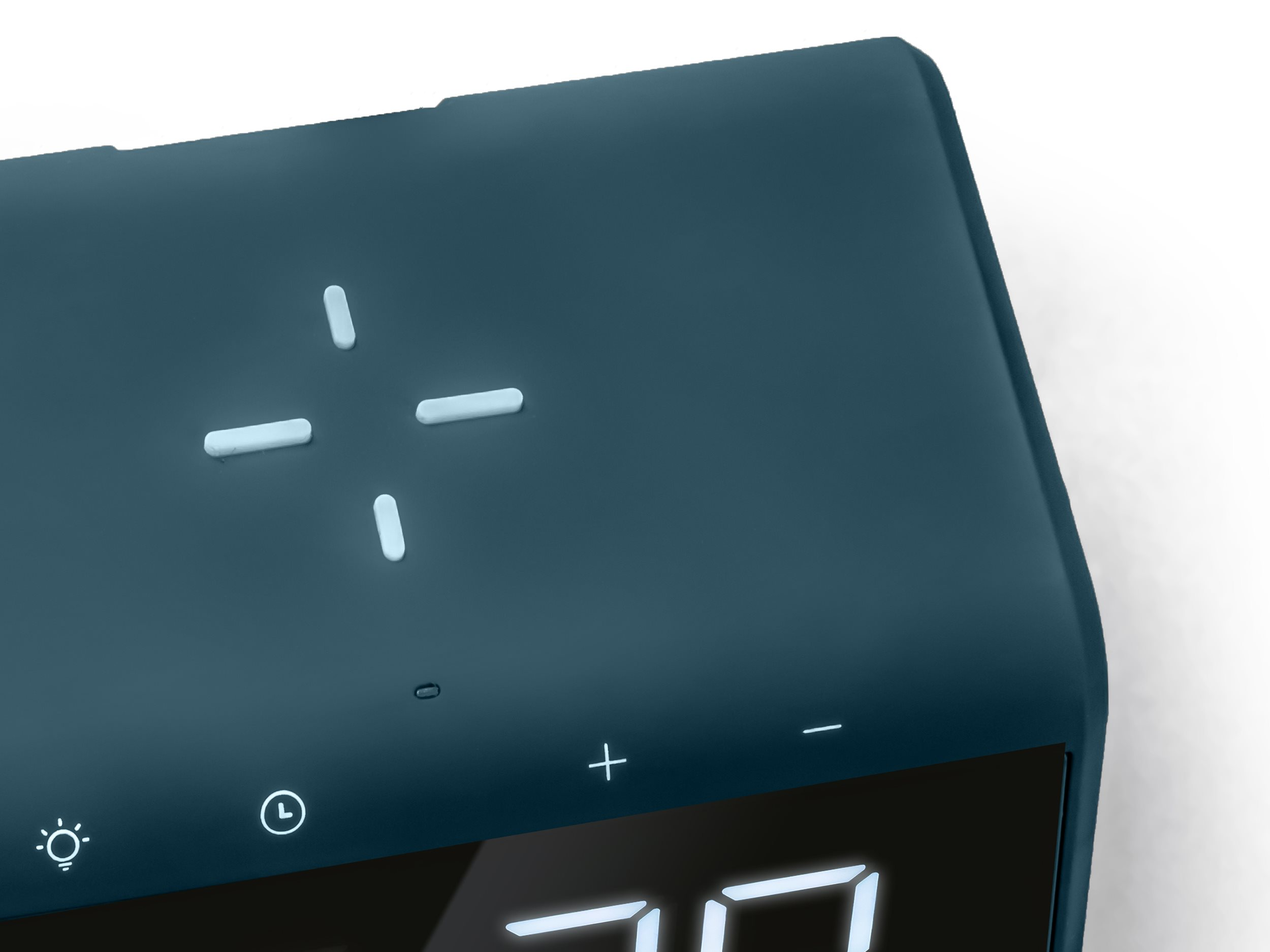 A dark teal alarm clock with illuminated buttons on top and a digital display.