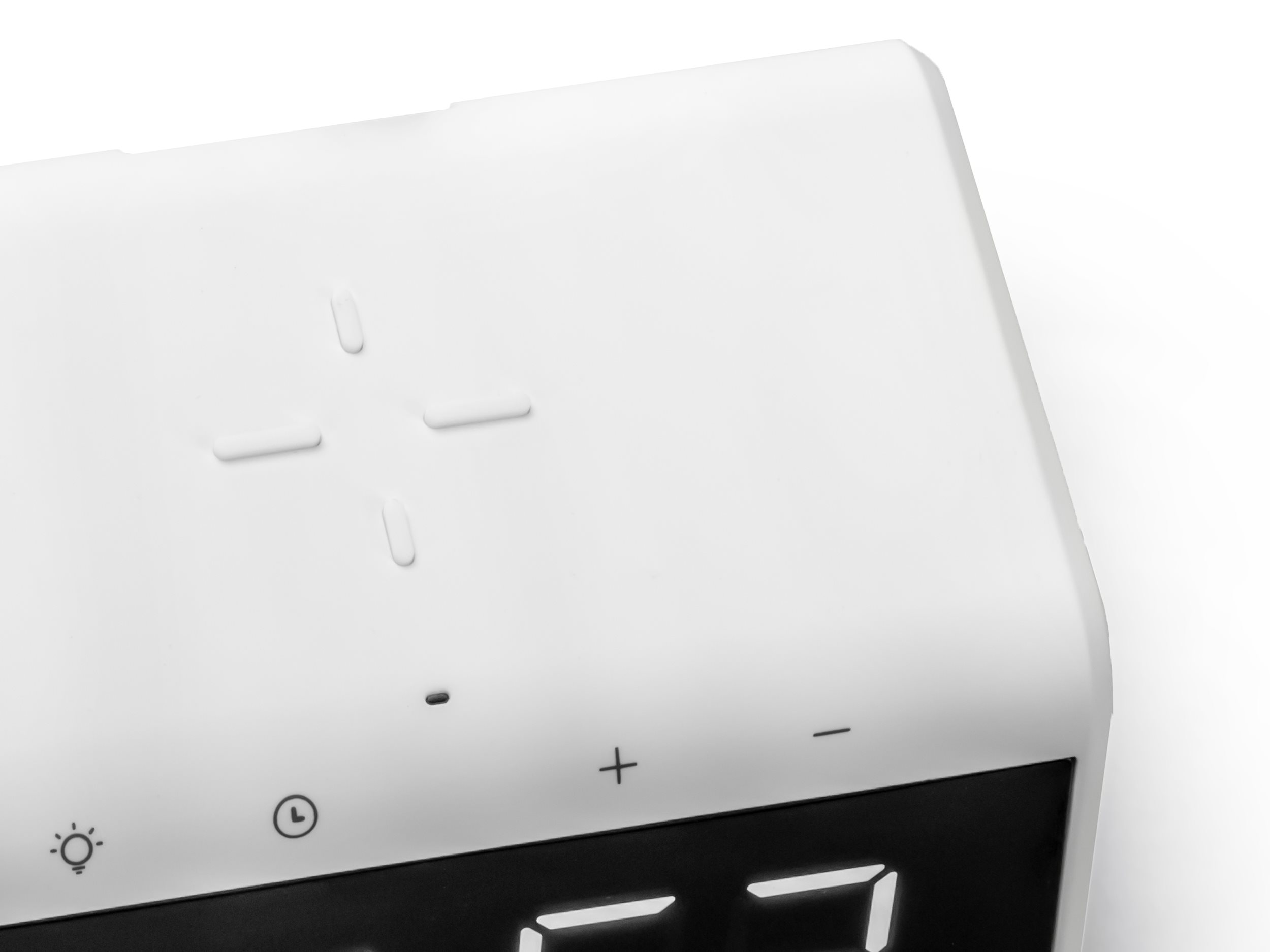 White control panel with buttons.  A clock and a light icon are visible.