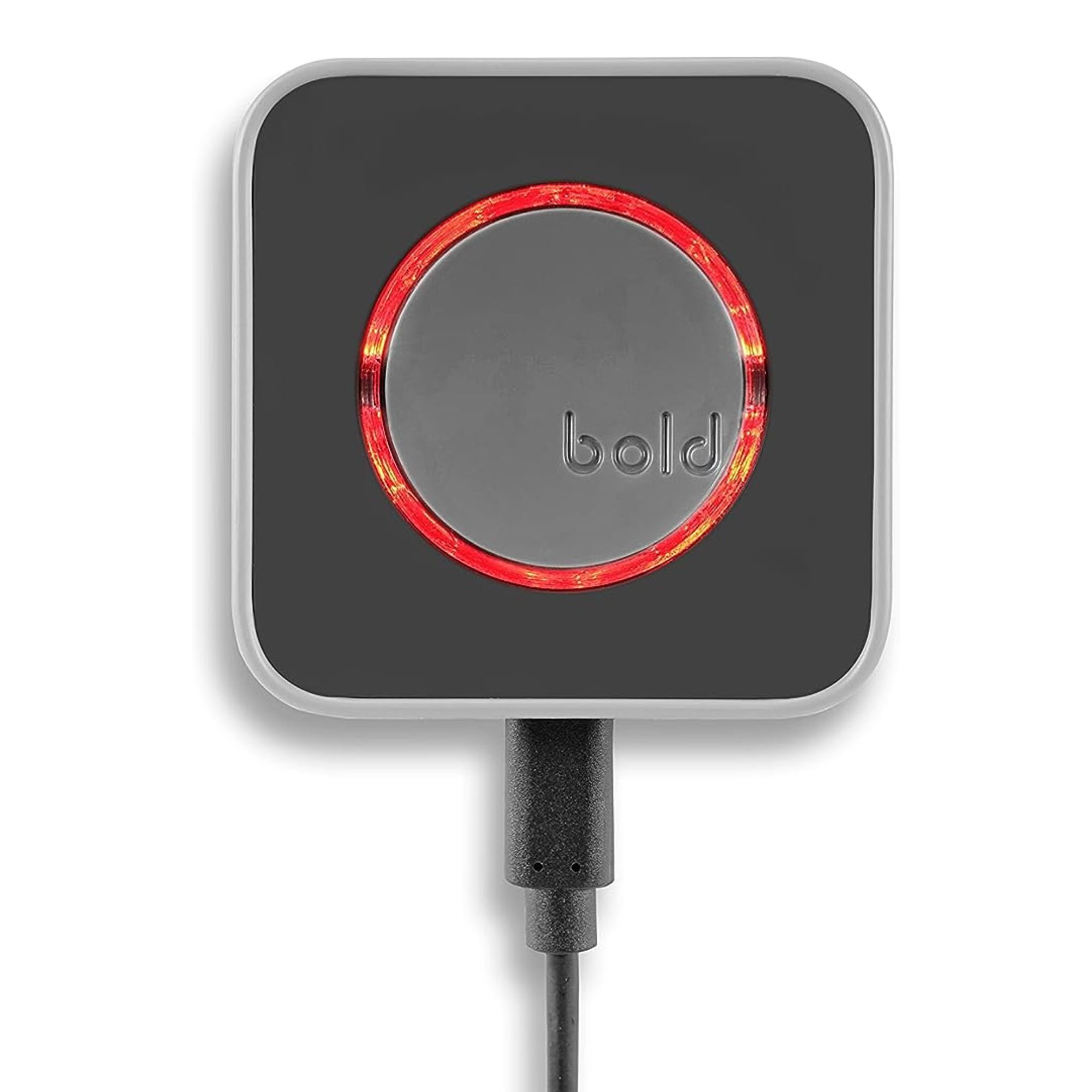 Un dispositivo cuadrado con una cara negra y un círculo rojo brillante. Un cable negro se extiende desde él.