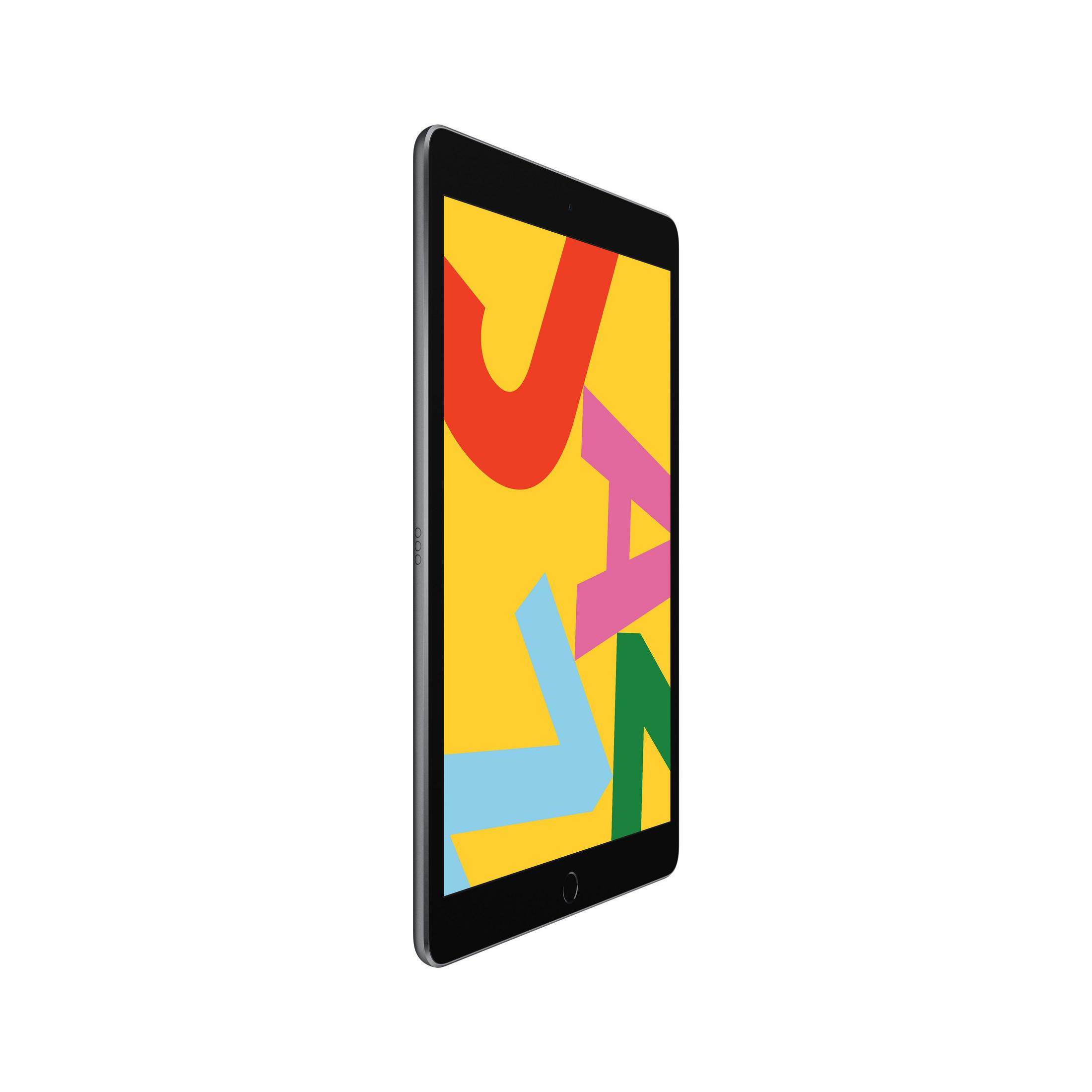 Czarny i żółty tablet z kolorowym ekranem wyświetlającym litery i abstrakcyjne kształty, widziany pod kątem.