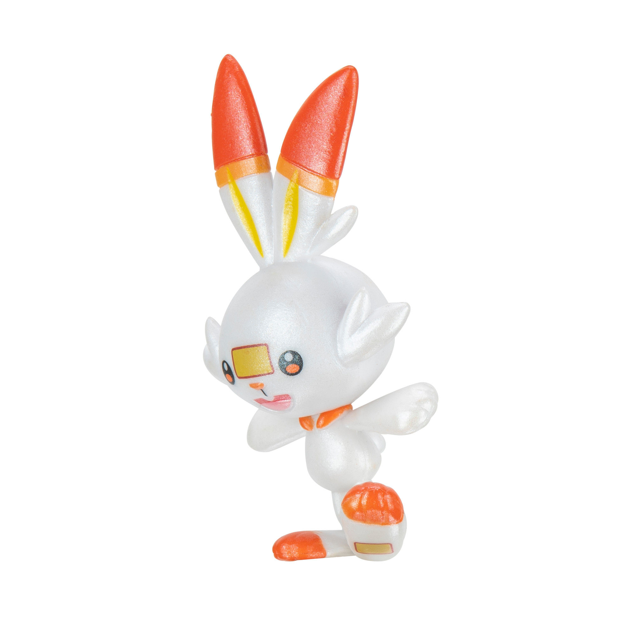 Weißes und orangefarbenes Pokémon-Spielzeug Scorbunny, das auf weißem Hintergrund steht.