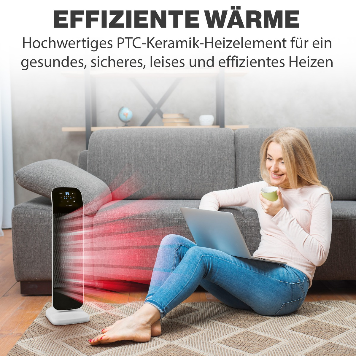 Kobieta siedząca na sofie w pobliżu grzejnika, trzymająca filiżankę i patrząca na laptopa.