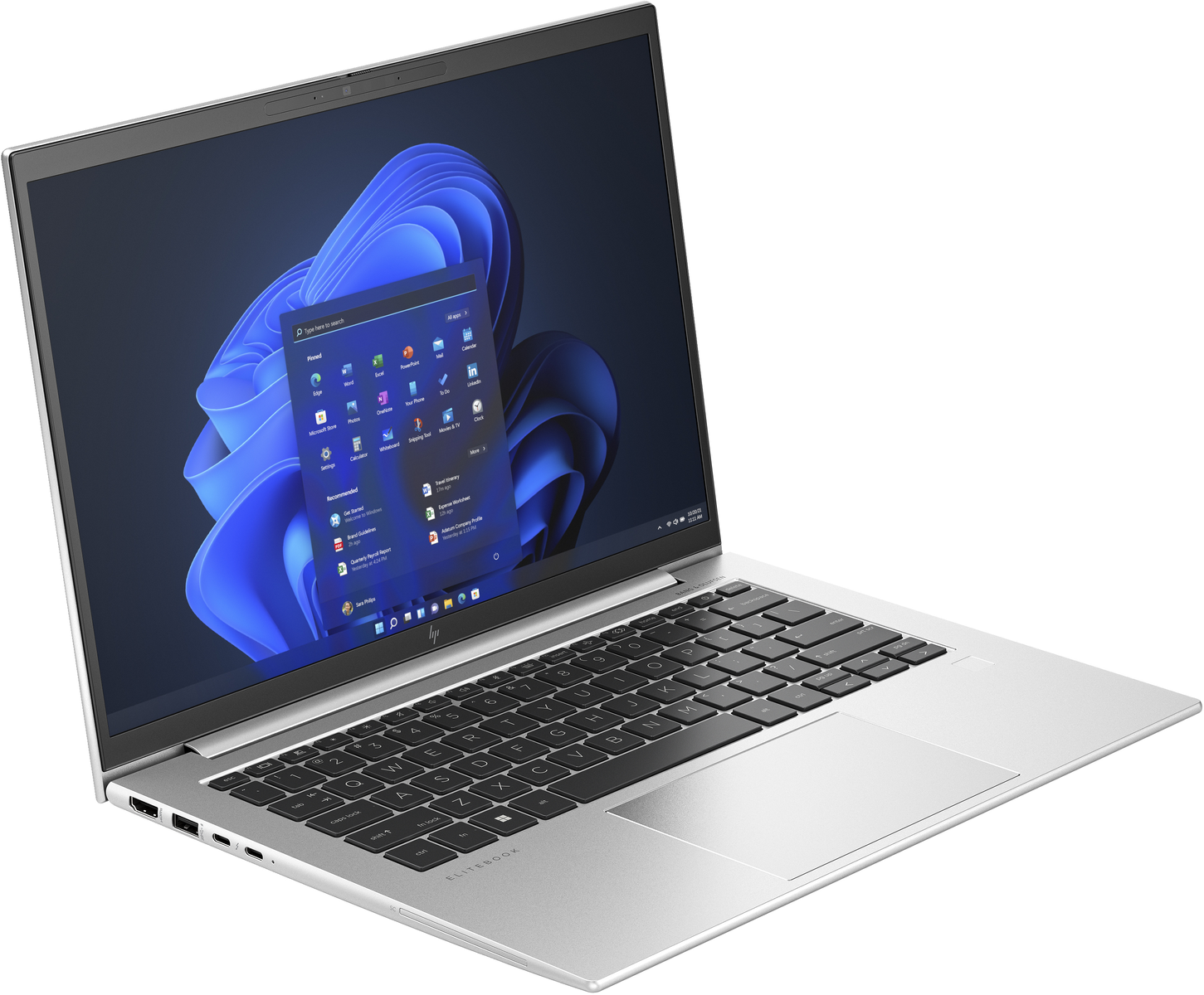 Un portátil plateado sobre una superficie blanca. La pantalla muestra un escritorio de Windows.