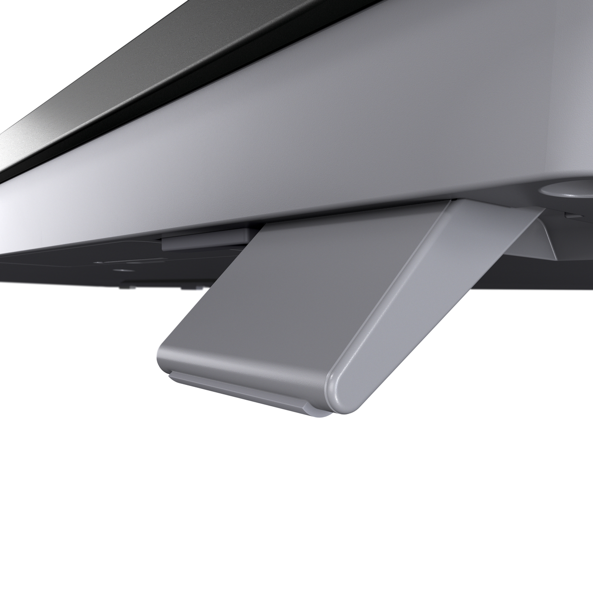 Un primer plano de una pata de soporte gris de un dispositivo electrónico.