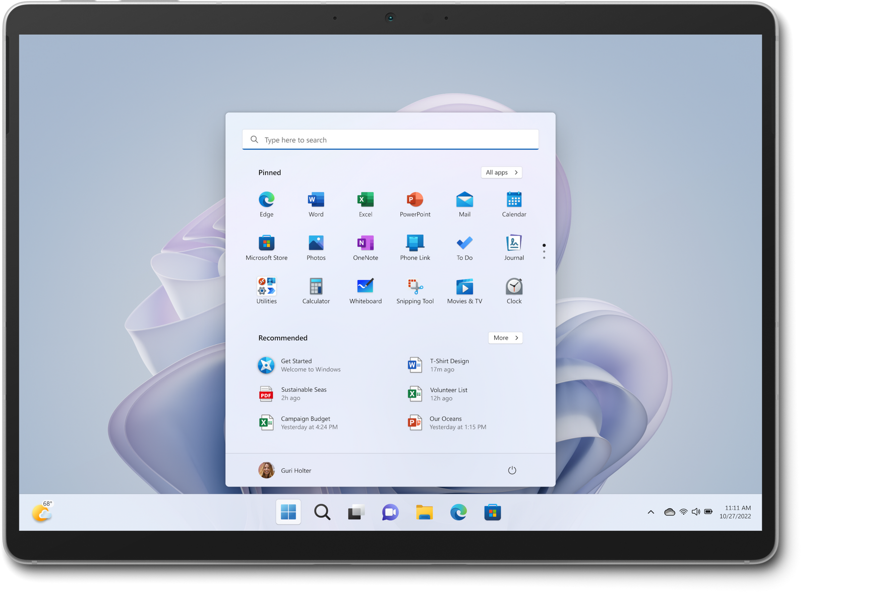 Tablet che mostra l'interfaccia di Windows 11. L'interfaccia mostra varie icone di app e una barra di ricerca.