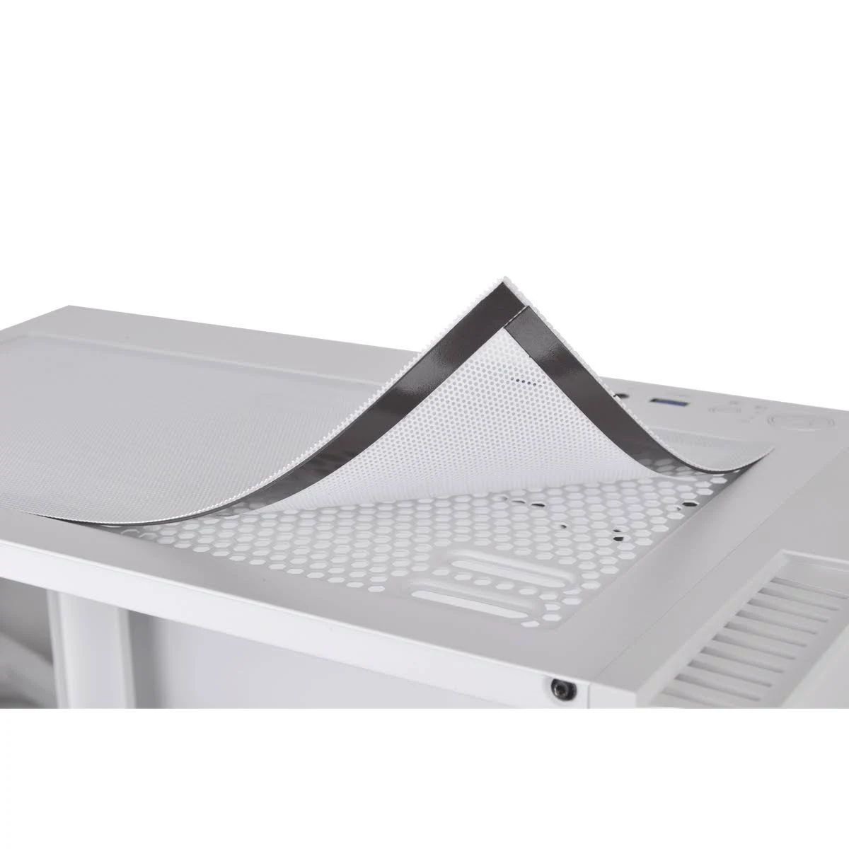 Biała obudowa komputera z wyjmowanym filtrem siatkowym podnoszonym z góry.