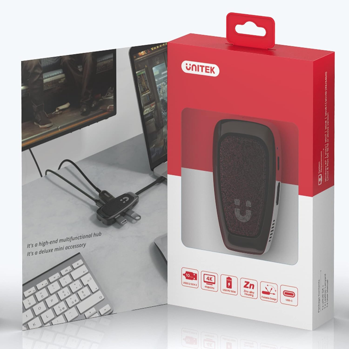 Scatola hub Unitek con accessori e display del monitor.