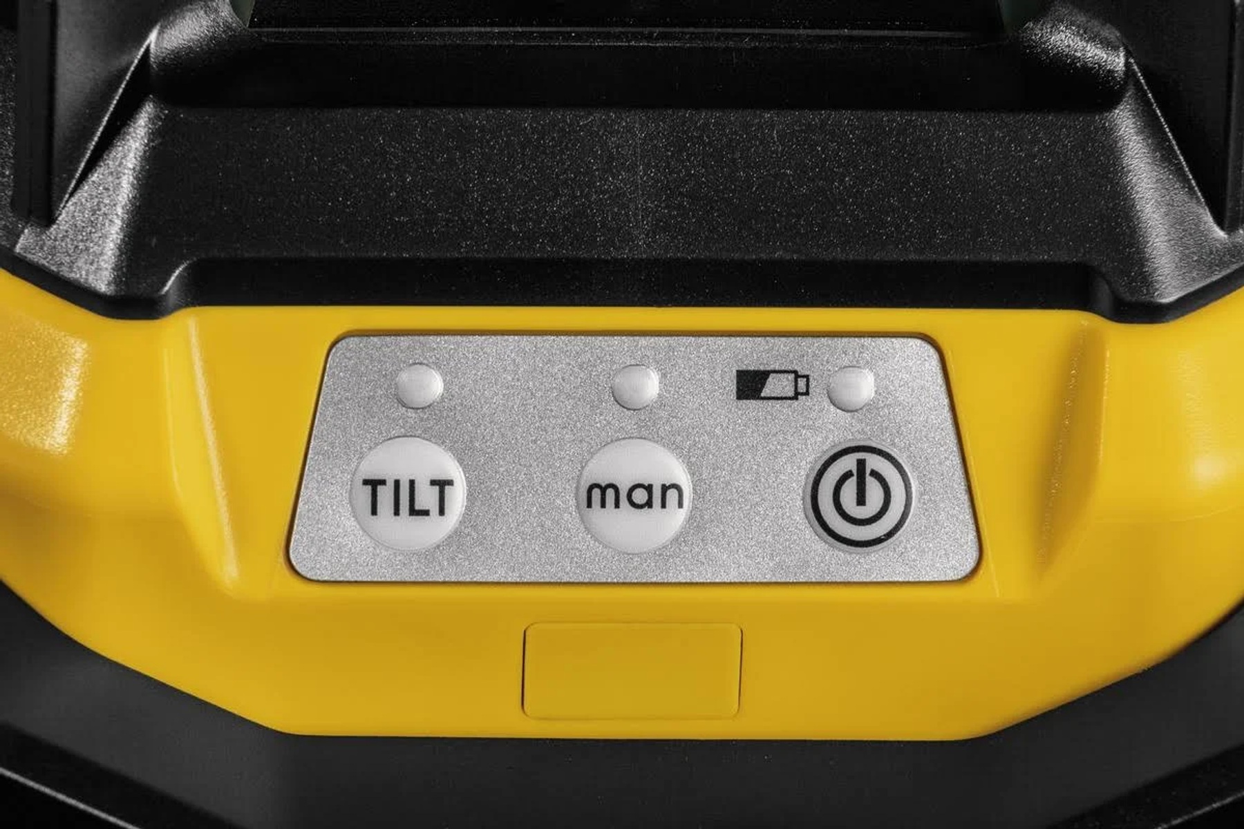 Pannello di controllo giallo e nero con pulsanti etichettati TILT, man e un simbolo di alimentazione.