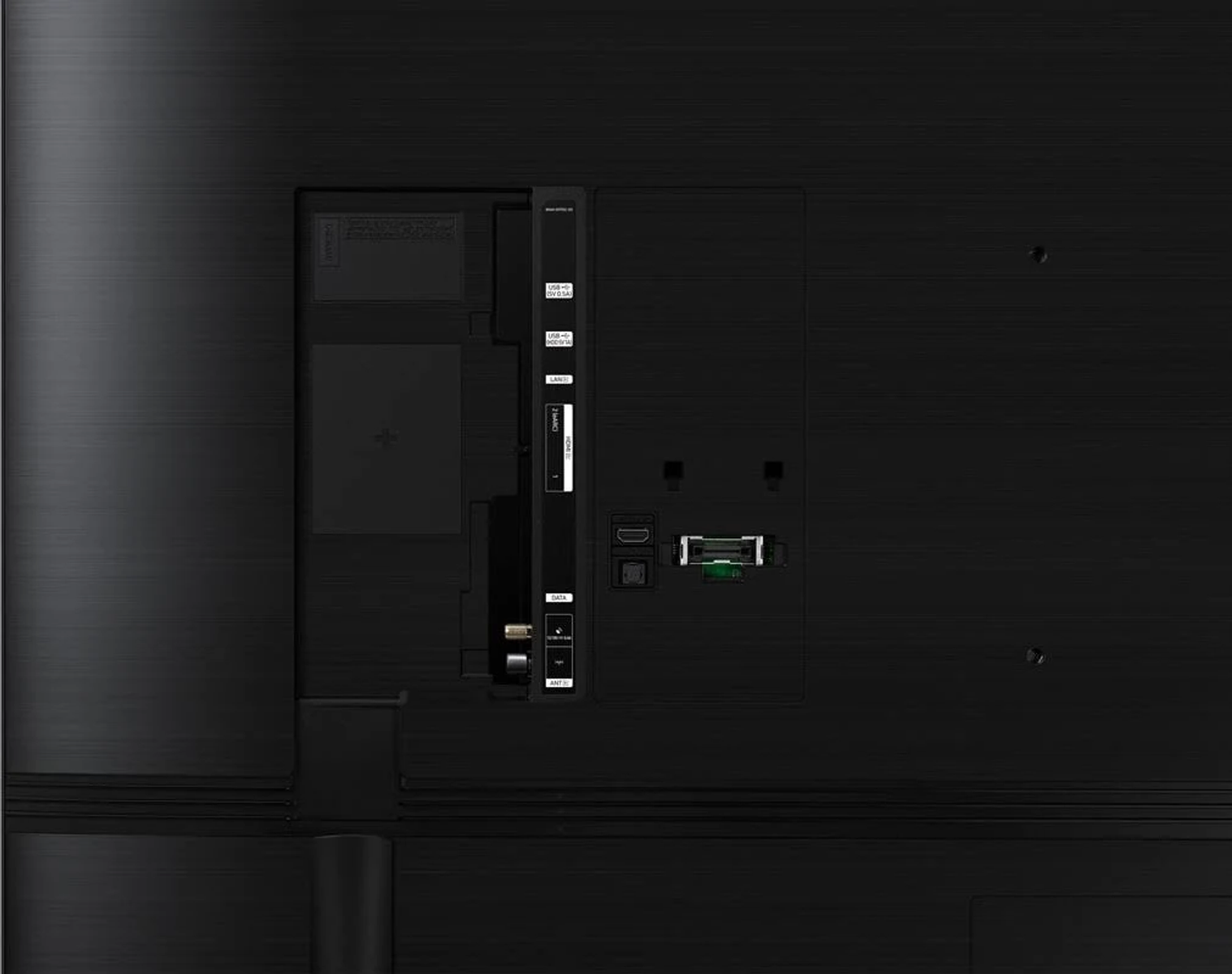Tył czarnego telewizora, pokazujący porty i połączenia.