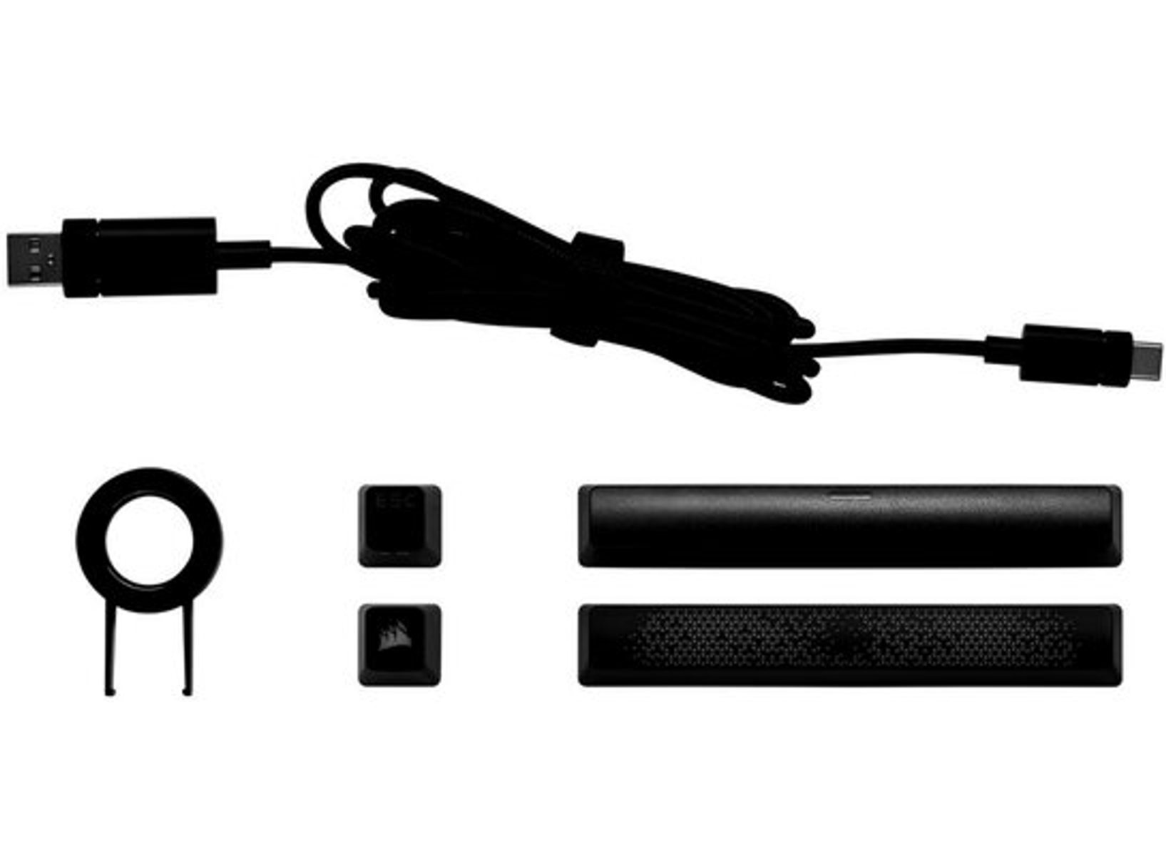 Accesorios de teclado negro: cable, teclas, extractor y barra de sonido.