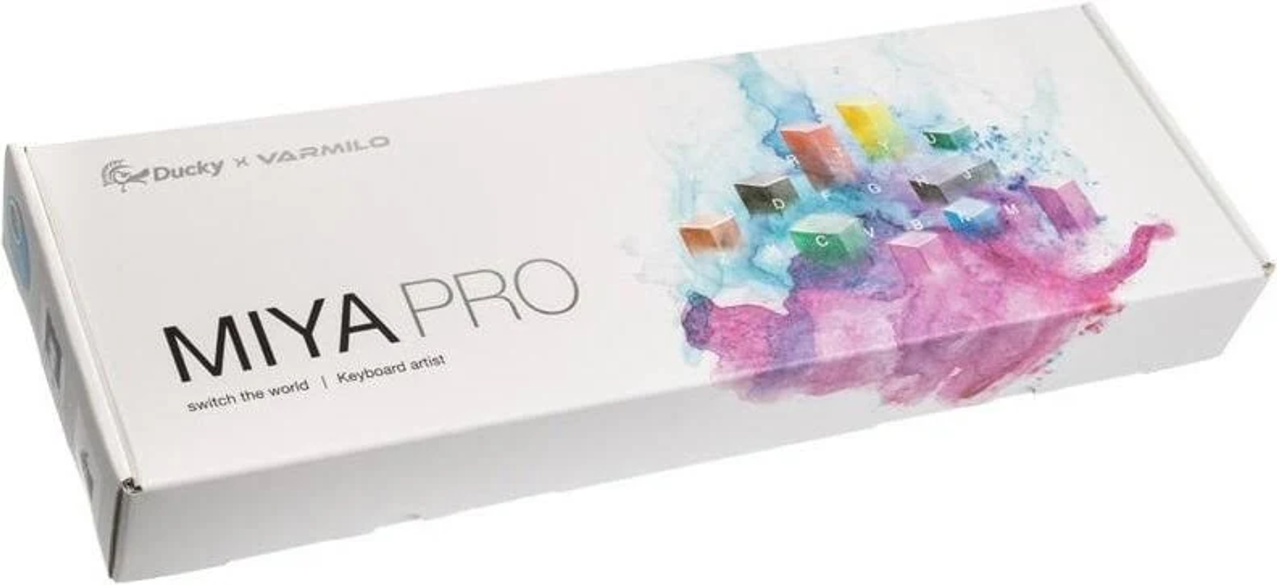 Eine weiße Tastatur-Box. Die Box zeigt bunte Tastenkappen und den Text 'MIYA PRO'.