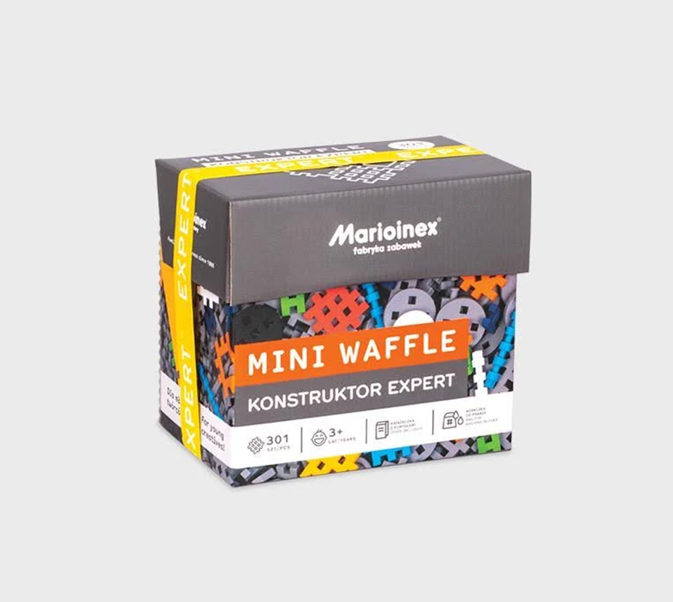 Pudełko z zabawkami konstrukcyjnymi 'Mini Waffle'. Pudełko jest szare i żółte.