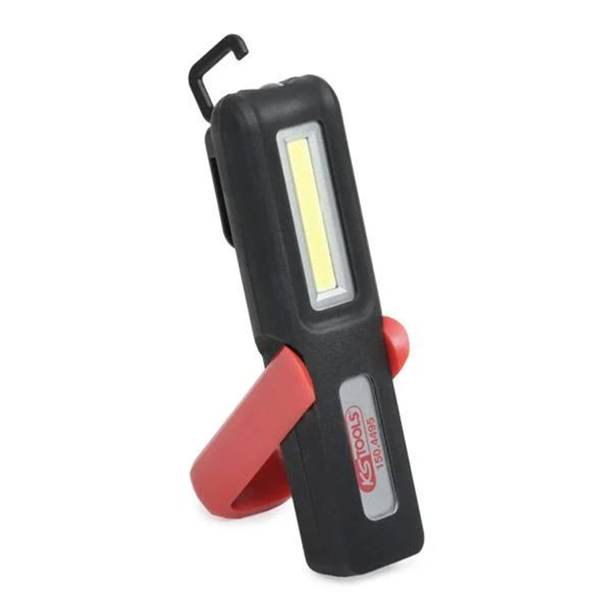 Czarna i czerwona lampa robocza KS TOOLS. Posiada hak i czerwony stojak. Światło jest białe.