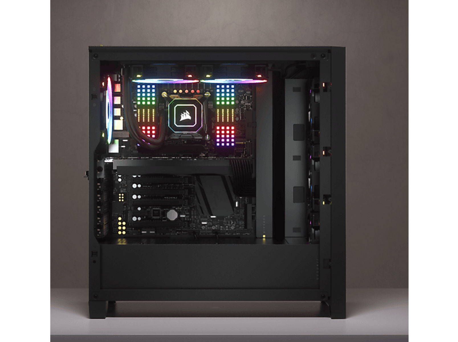 Wnętrze obudowy komputera z kolorowymi diodami LED na komponentach.