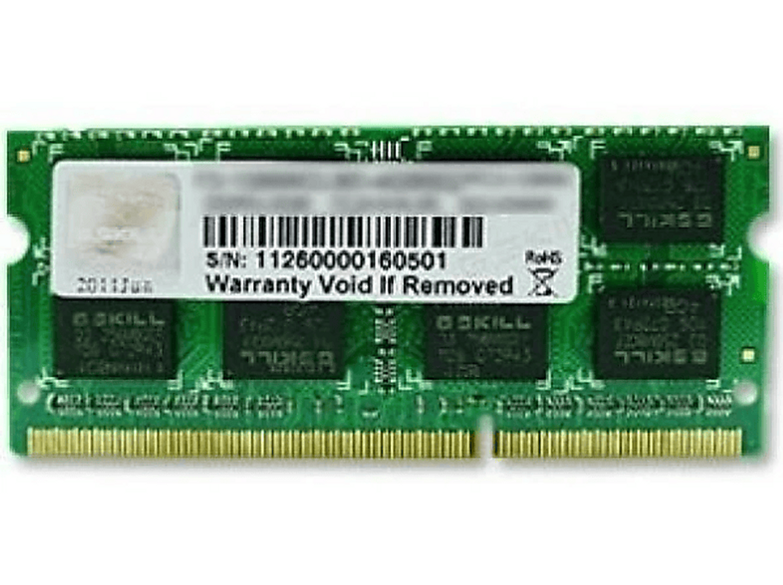 Module RAM vert avec une étiquette blanche. L'étiquette dit 'Garantie Annulée Si Retiré'. Il y a des puces.