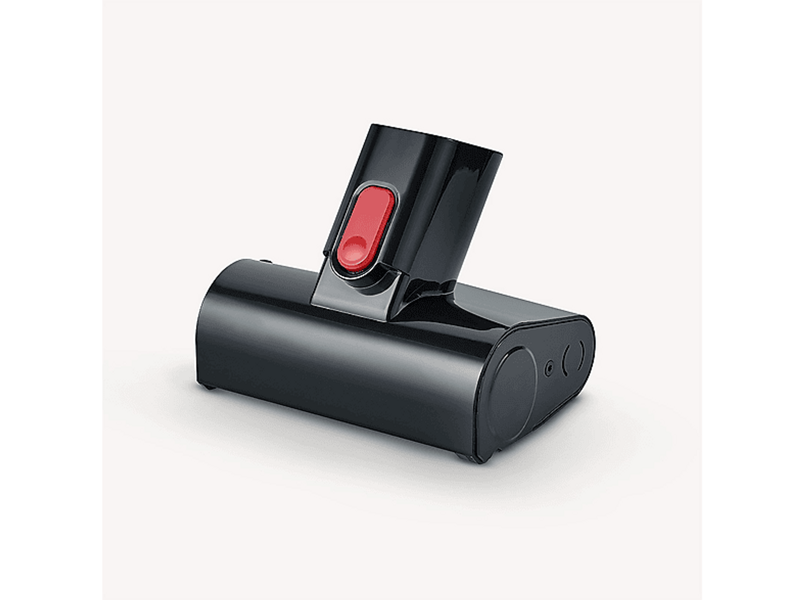 Czarna nasadka do odkurzacza z czerwonym przyciskiem. Widok z boku na białym tle.