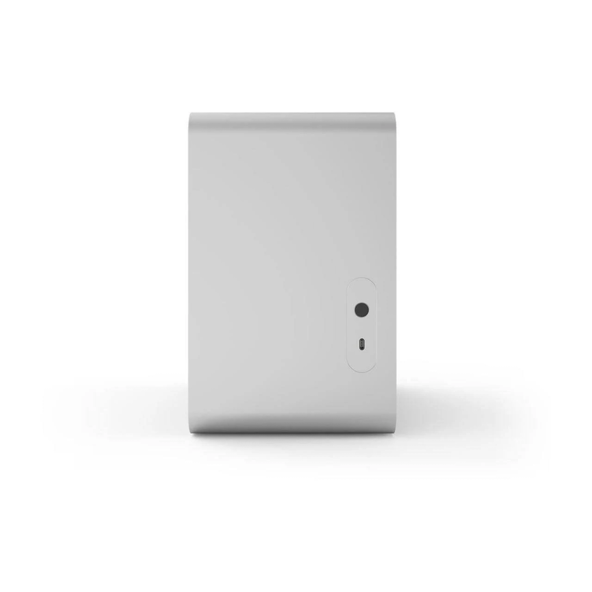 Srebrne urządzenie na białej powierzchni. Posiada przycisk i mały port.