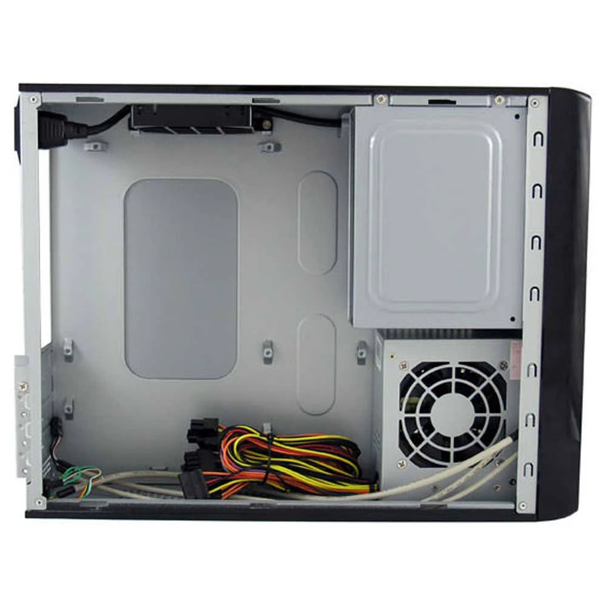 Computer case interior with components. Metal frame, power supply, and various cables are visible.