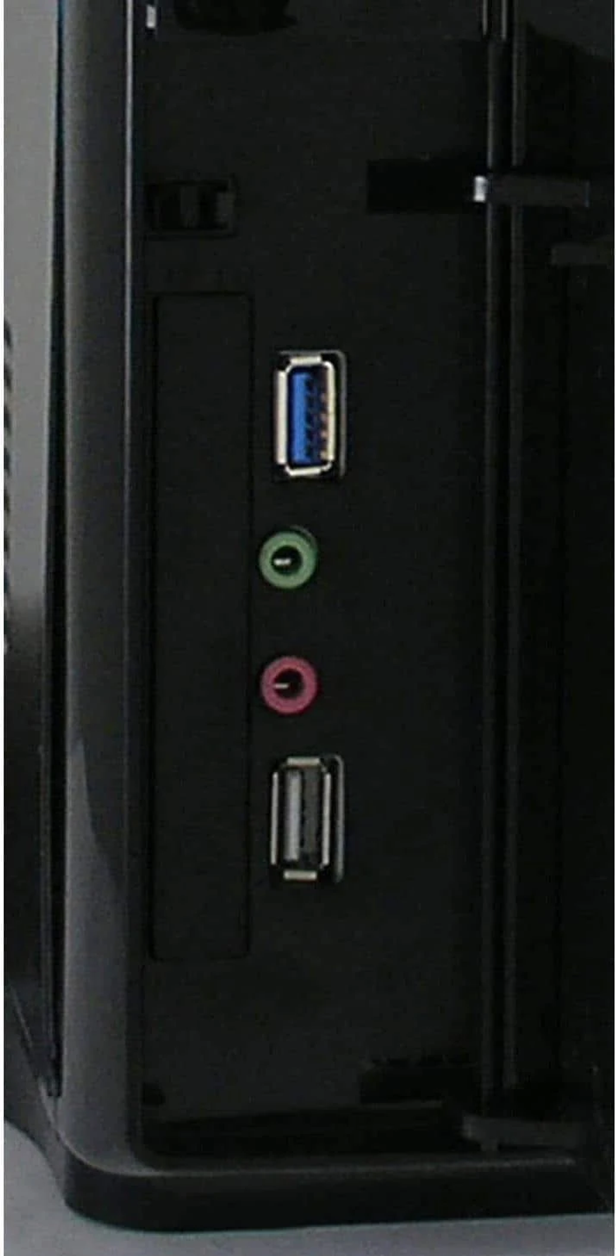 Close-up of a computer case's back panel. It shows USB, audio ports, and the case itself.