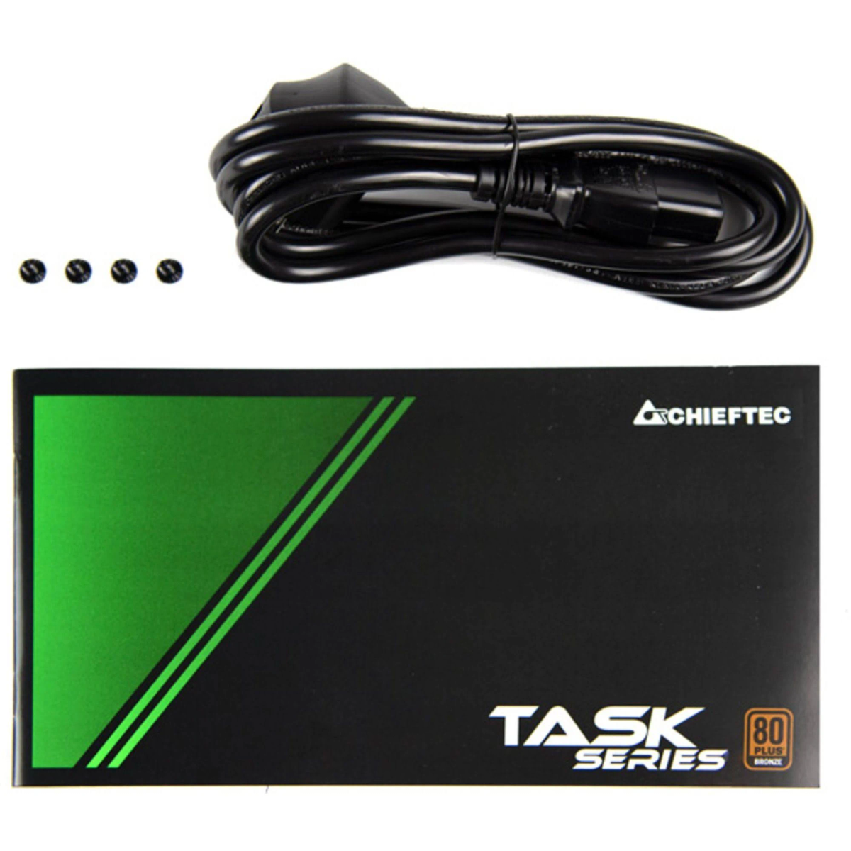 Czarny karton z zasilaczem z zielonym paskiem i czarnym kablem. Widoczne cztery śruby.