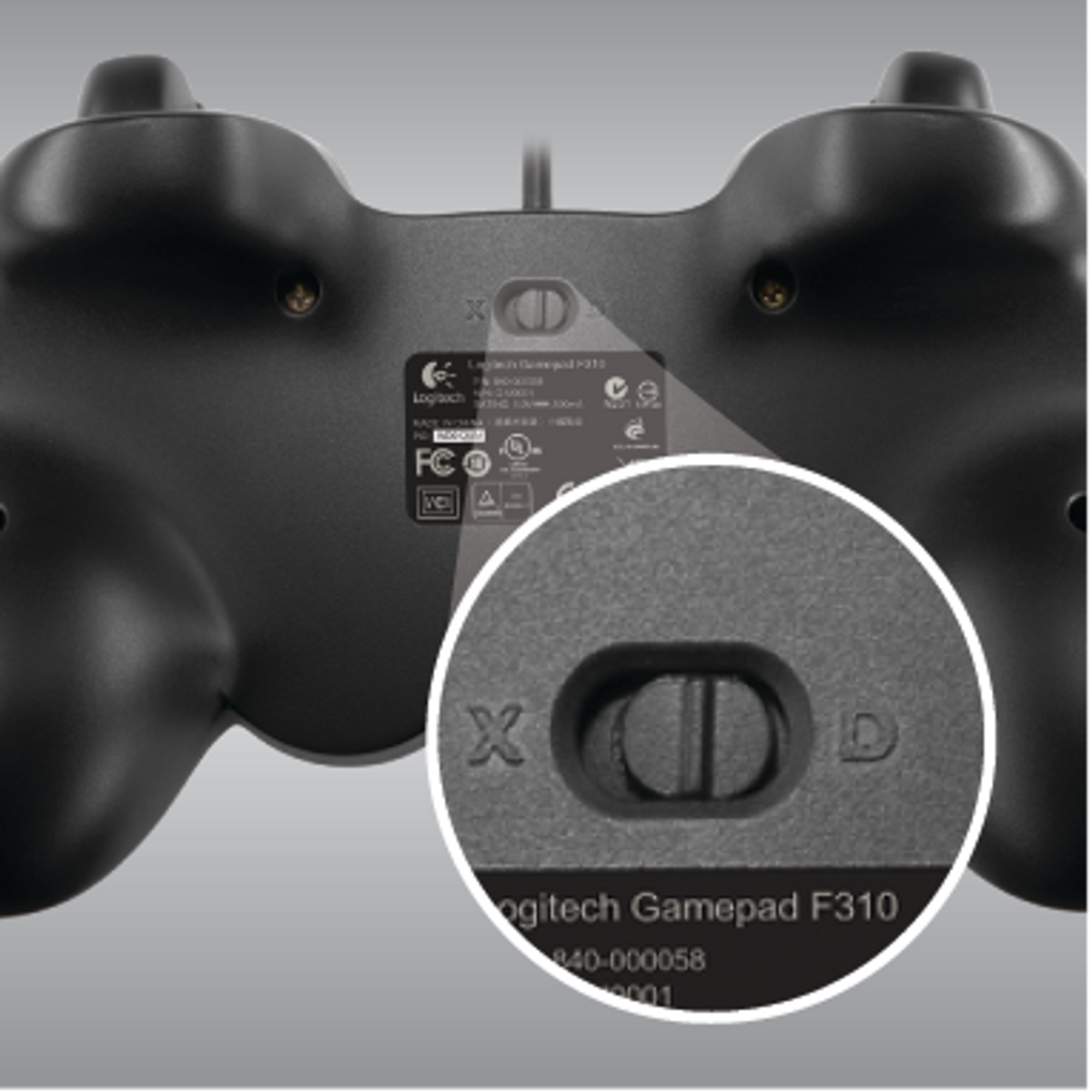 Gamepad Logitech F310. Zbliżenie tyłu z przełącznikiem X/D.