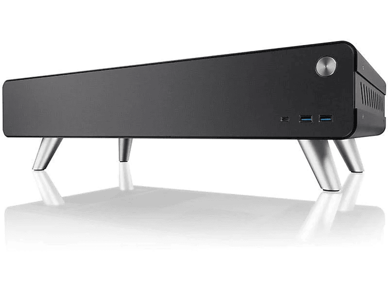Schwarzes Computergehäuse mit silbernen Beinen, sichtbare Anschlüsse.