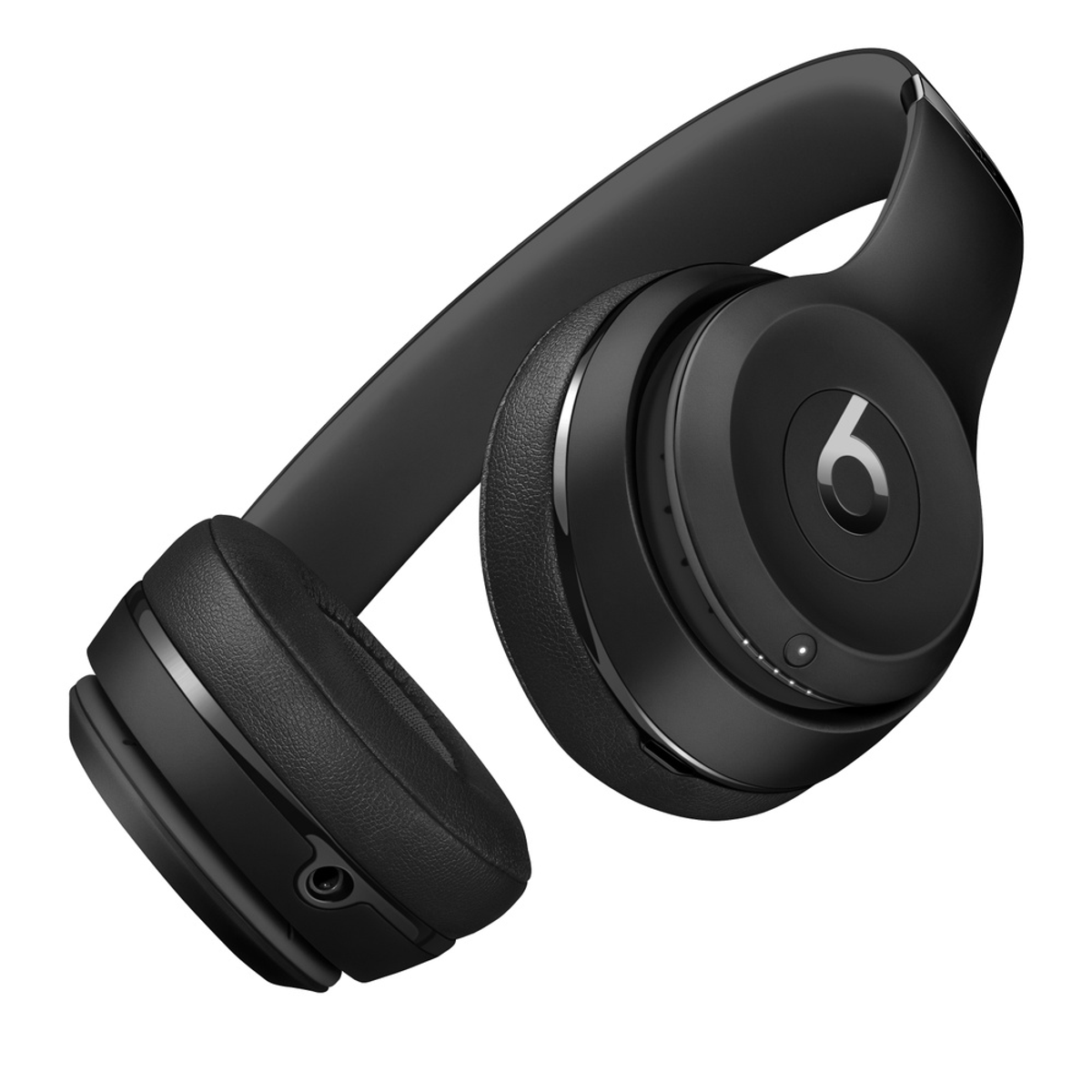Auriculares Beats negros sobre fondo blanco, mostrando auriculares y diadema.